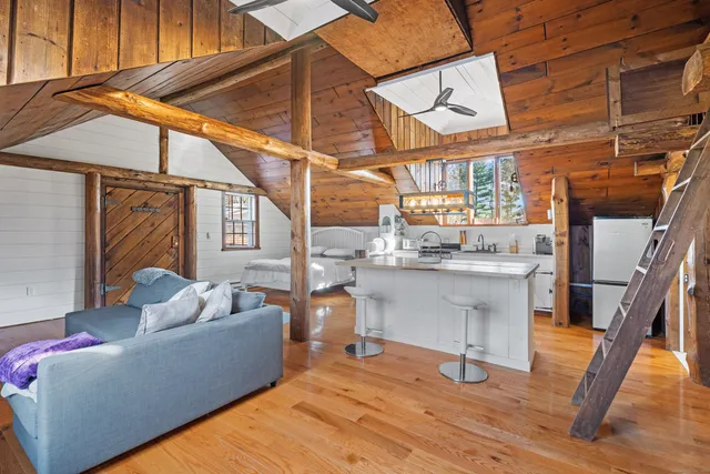 a open kitchen with stainless steel appliances granite countertop a sink a stove and cabinets