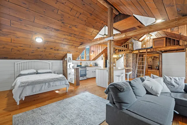 a bathroom with a granite countertop sink a toilet and shower