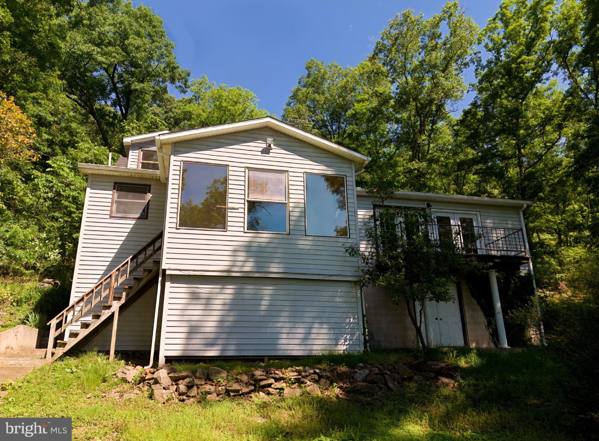 2932 Kerns School Road Springfield, WV 26763 - Photo 28 of 35 Charming home nestled in lush greenery.