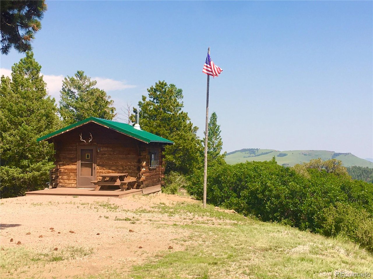 1251 Antelope Trail Cotopaxi, CO 81223 - Photo 24 of 38 a front view of a house with a yard