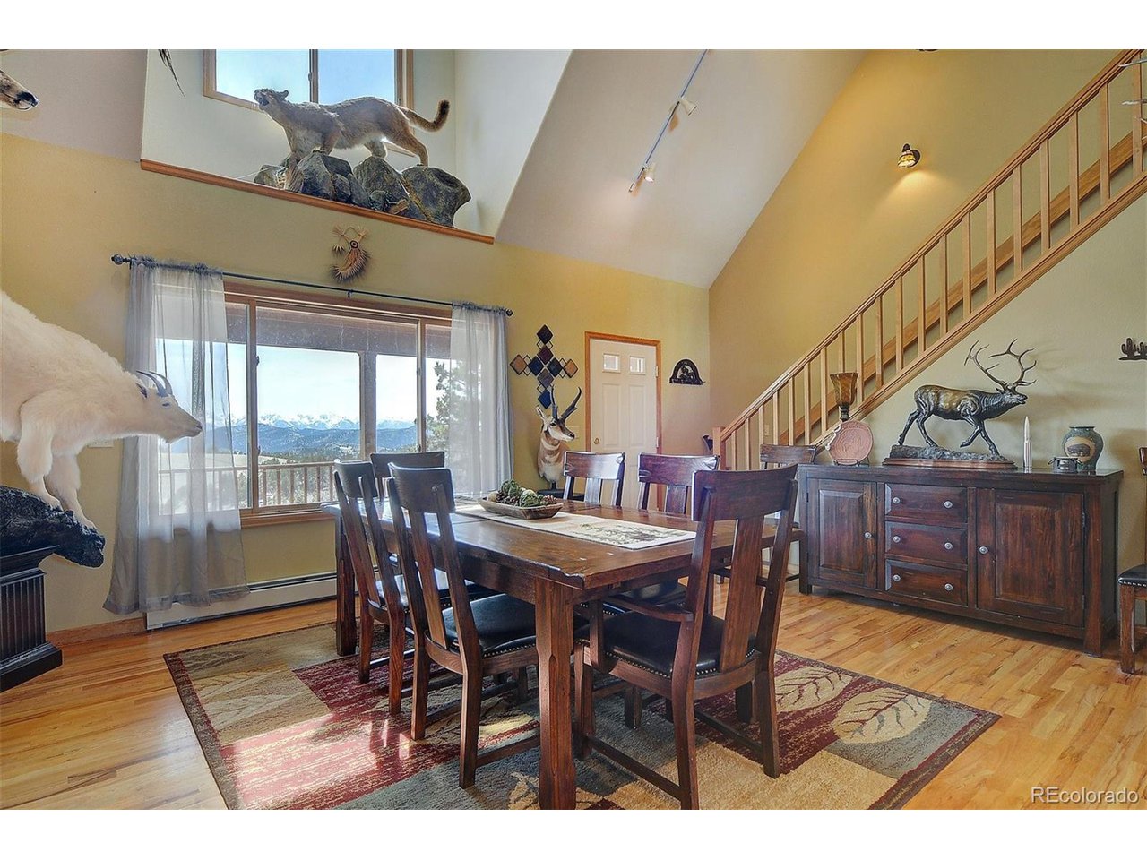 1251 Antelope Trail Cotopaxi, CO 81223 - Photo 9 of 38 a view of a dining room with furniture window and wooden floor