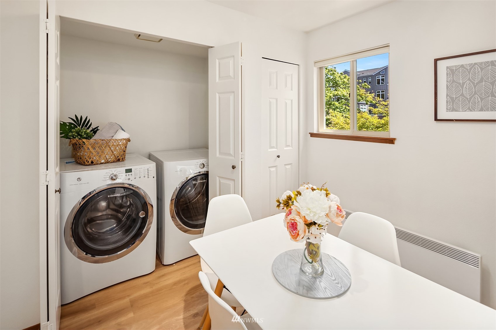 605 5th Street, Unit B 303 Kirkland, WA 98033 - Photo 13 of 18 a view of dining room and kitchen island with furniture