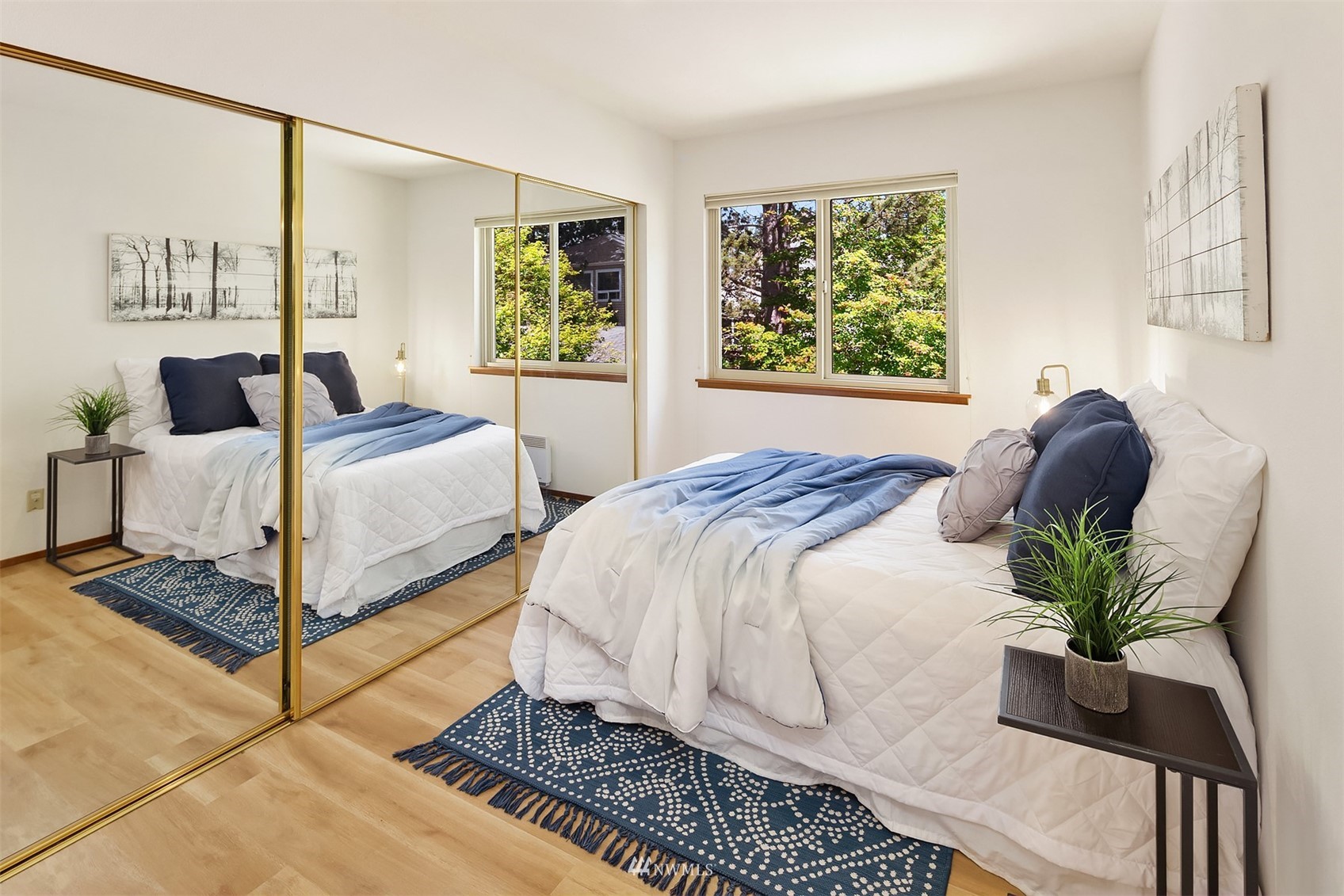 605 5th Street, Unit B 303 Kirkland, WA 98033 - Photo 14 of 18 a bedroom with a bed table and a window