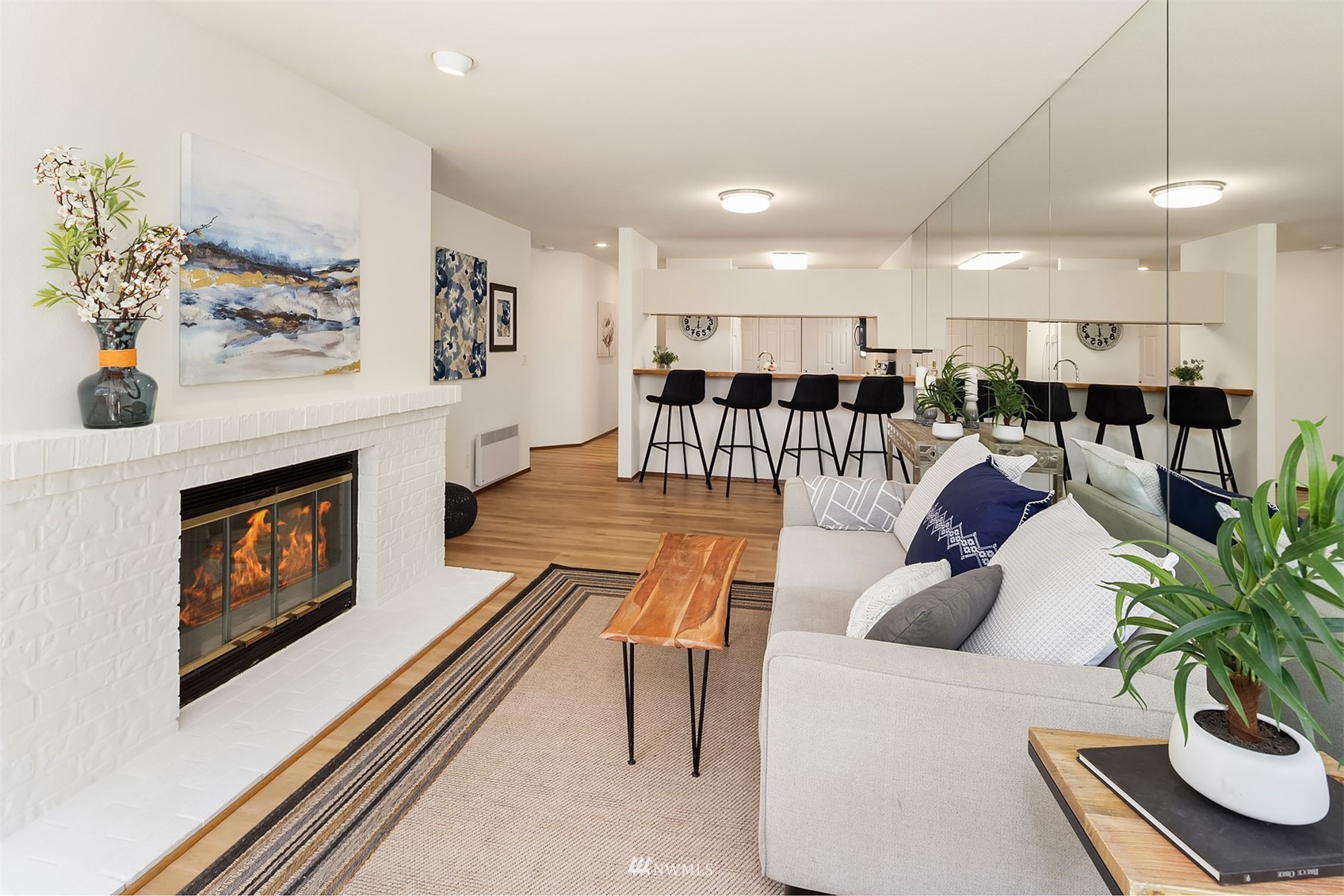 605 5th Street, Unit B 303 Kirkland, WA 98033 - Photo 3 of 18 a living room with furniture and a fireplace