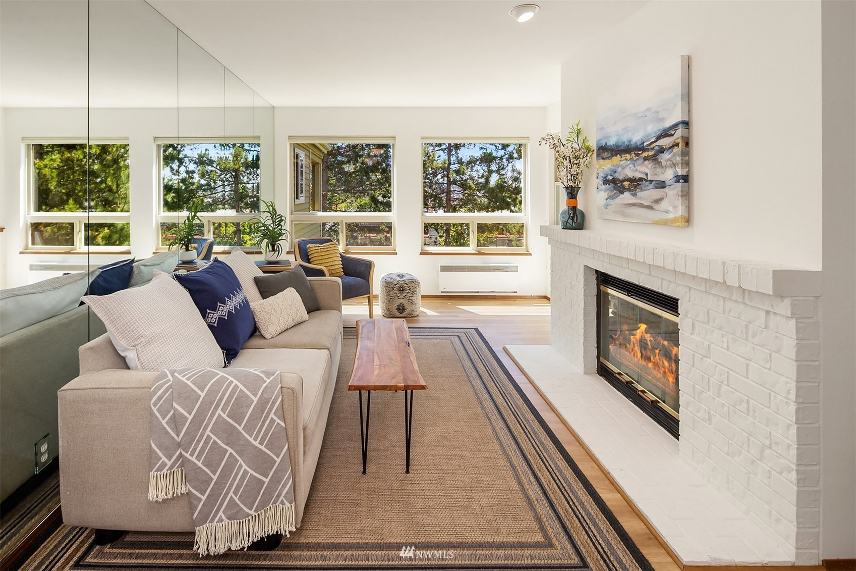 605 5th Street, Unit B 303 Kirkland, WA 98033 - Photo 4 of 18 a living room with furniture large windows and wooden floor
