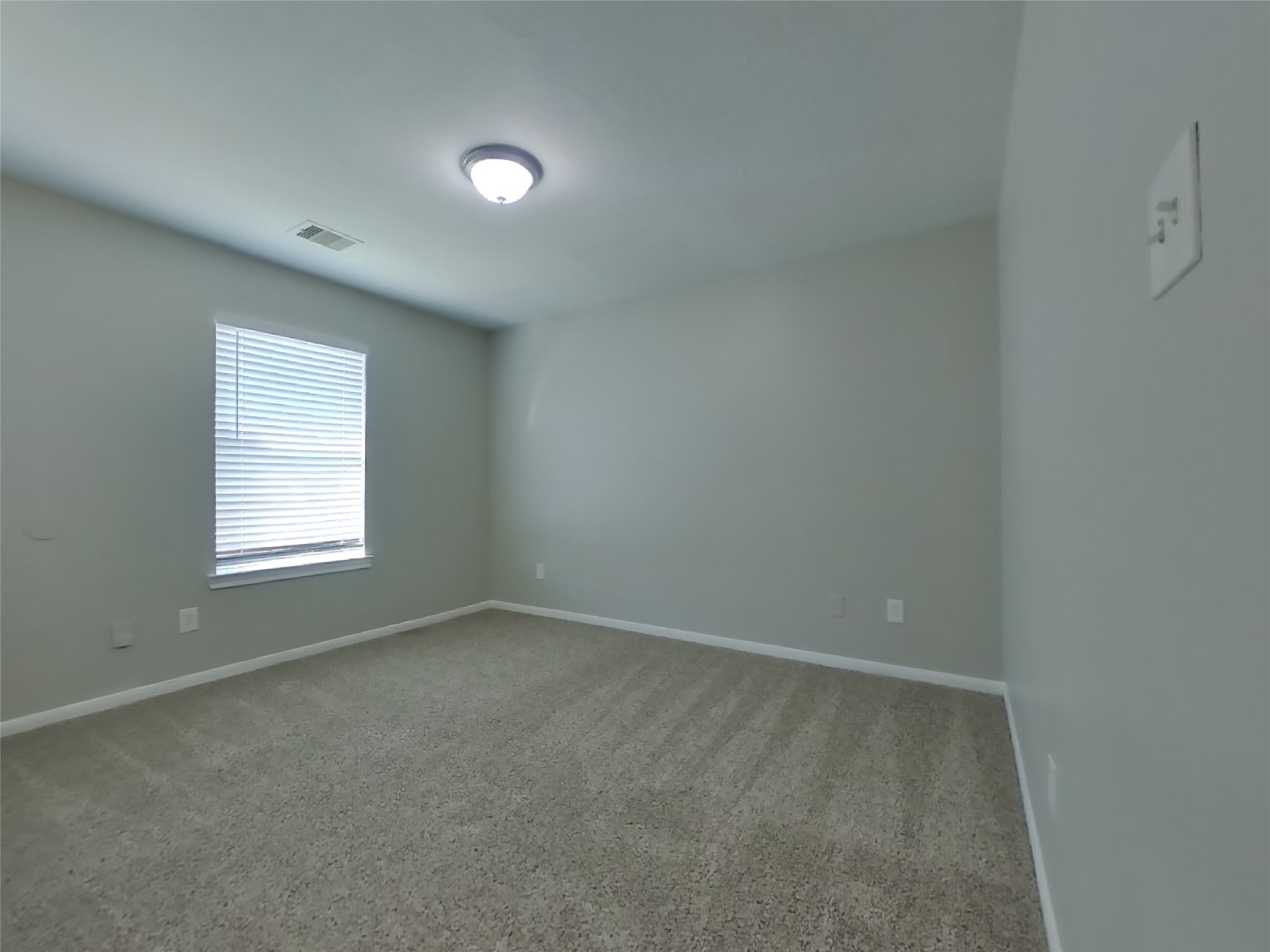 11415 Carla Street Houston, TX 77076 - Photo 11 of 15 an empty room with a window