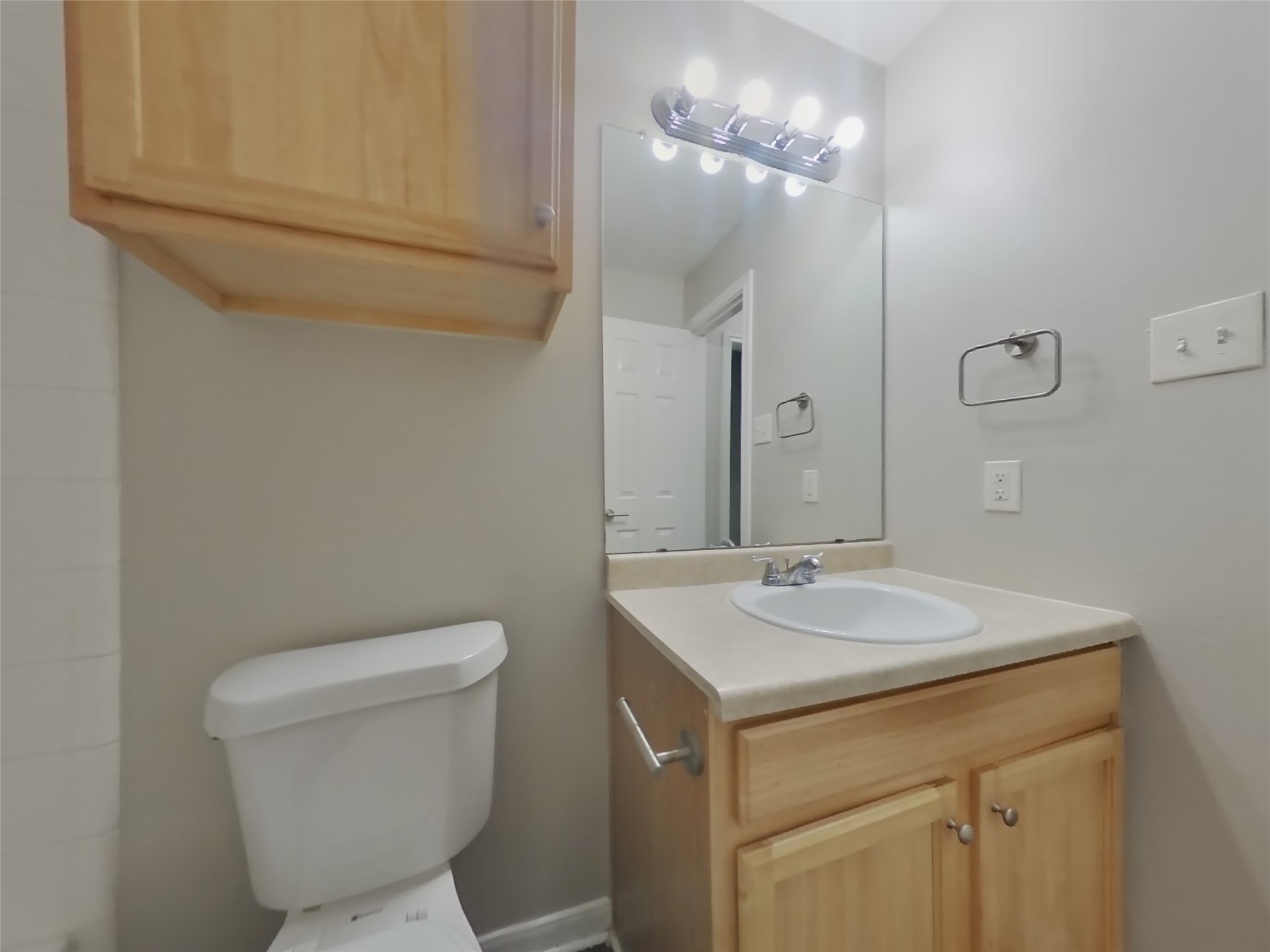 11415 Carla Street Houston, TX 77076 - Photo 13 of 15 a bathroom with a toilet sink and mirror