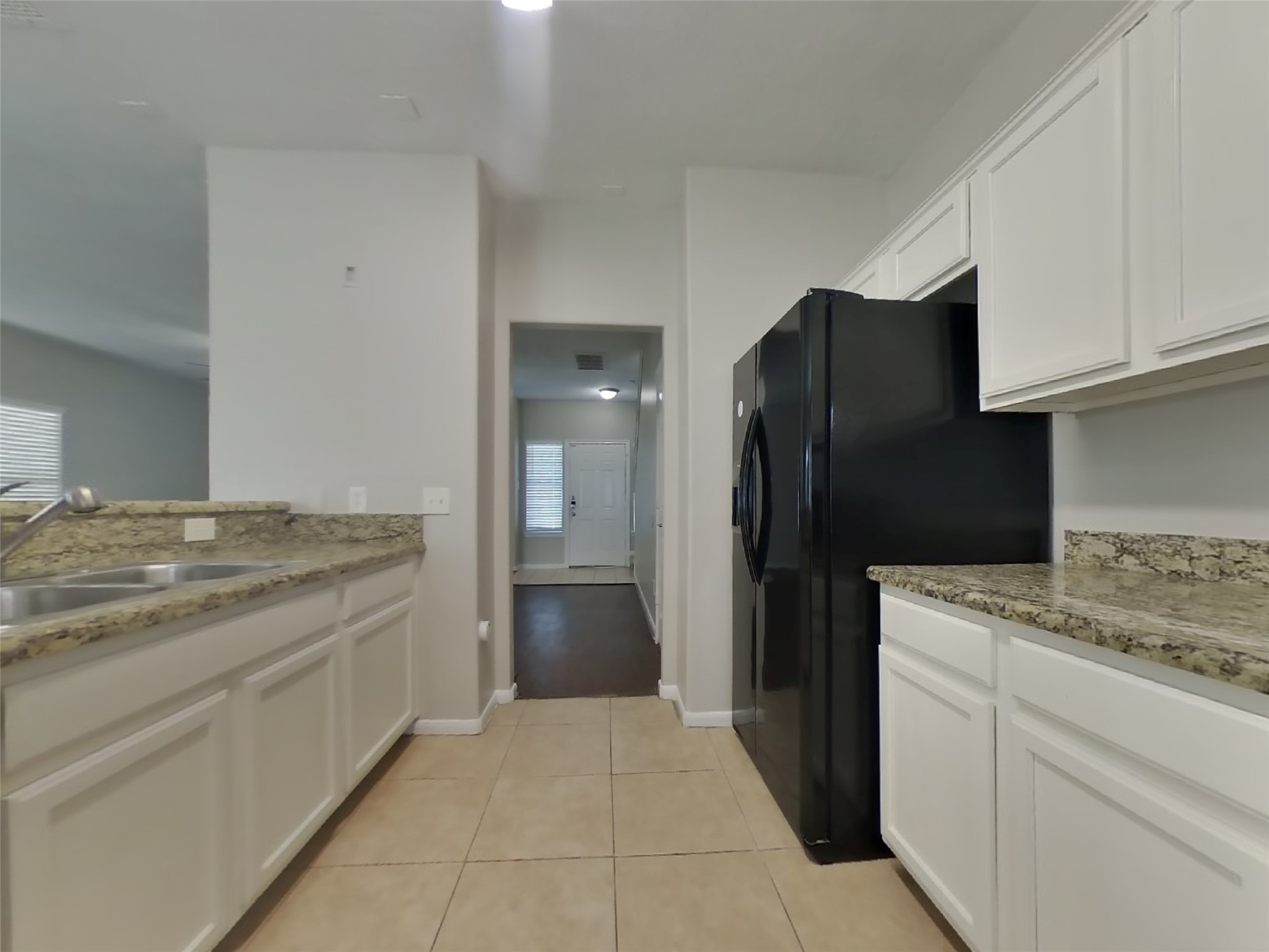 11415 Carla Street Houston, TX 77076 - Photo 7 of 15 a kitchen with a stove a refrigerator and a sink
