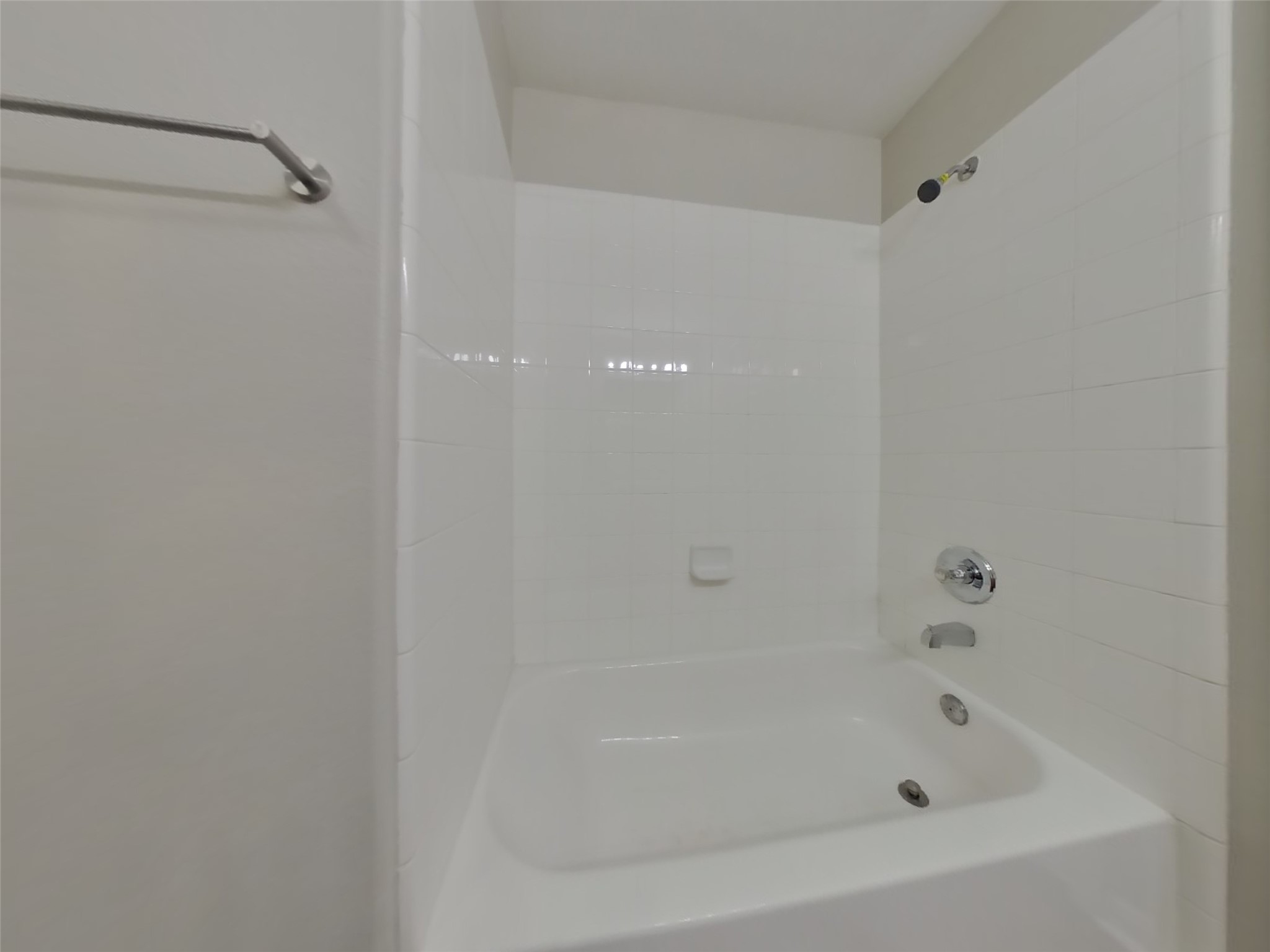 11415 Carla Street Houston, TX 77076 - Photo 10 of 15 a close up of a bathtub in a bathroom