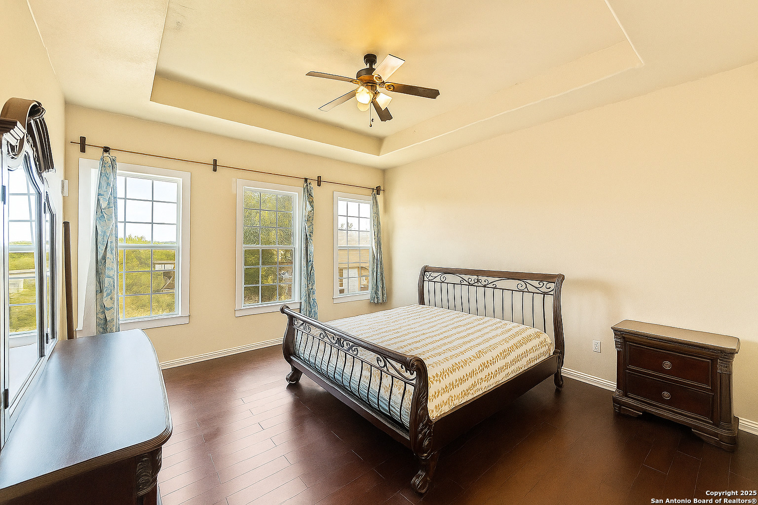 2211 Geneva Street Castroville, TX 78009 - Photo 16 of 41 a bed sitting in a bedroom next to a window