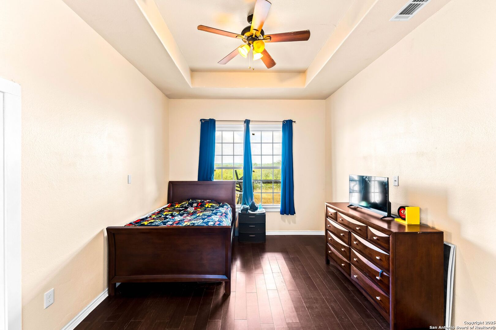 2211 Geneva Street Castroville, TX 78009 - Photo 21 of 41 a bedroom with furniture and a window