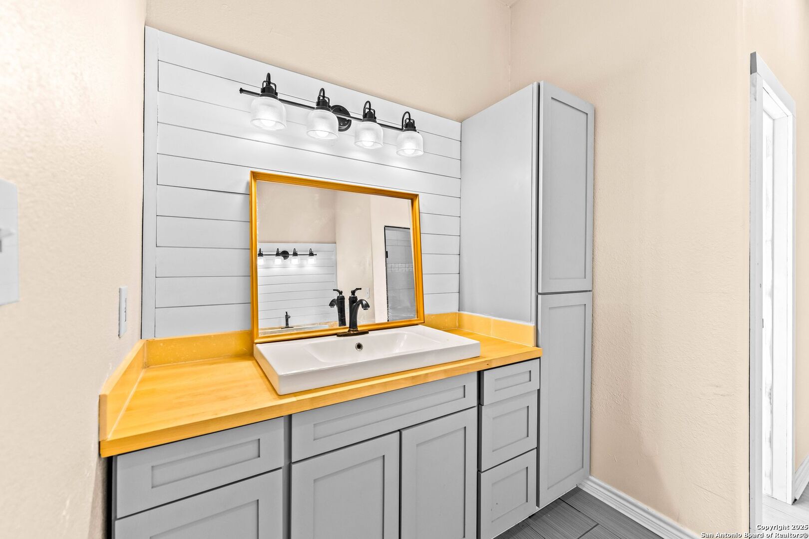 2211 Geneva Street Castroville, TX 78009 - Photo 33 of 41 a bathroom with a sink and a mirror