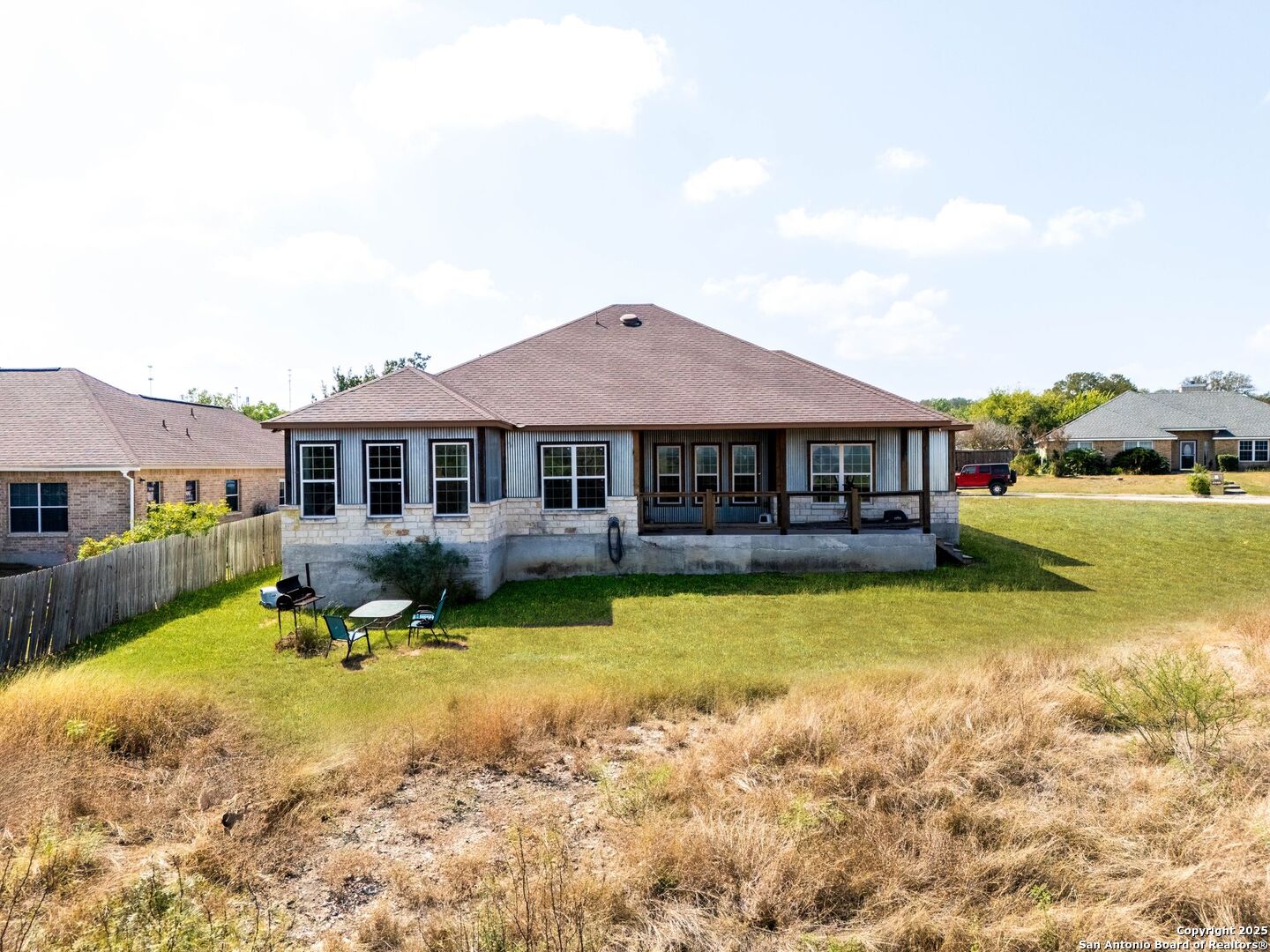 2211 Geneva Street Castroville, TX 78009 - Photo 38 of 41 a view of a house with swimming pool and a yard
