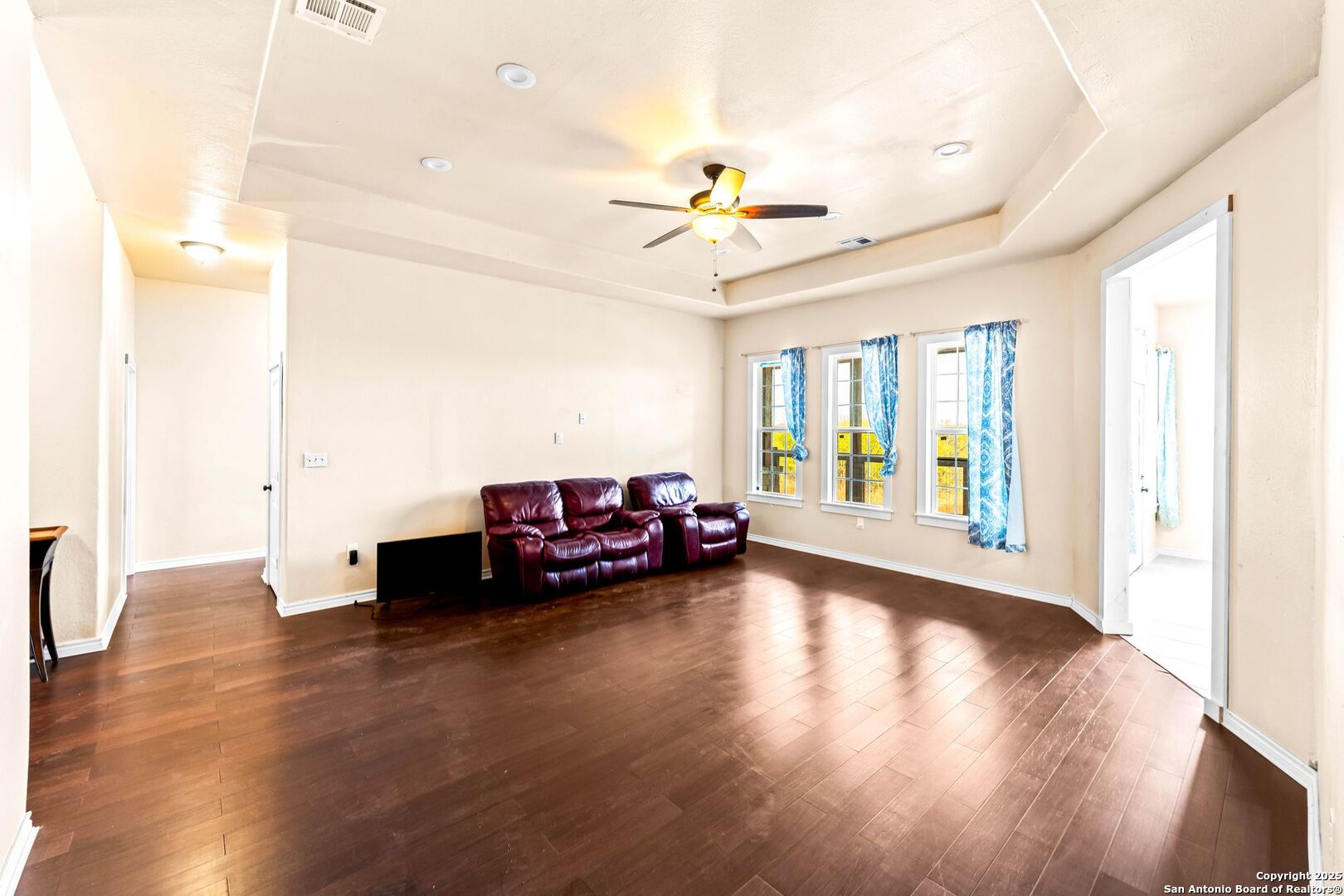 2211 Geneva Street Castroville, TX 78009 - Photo 6 of 41 a living room with furniture and wooden floor