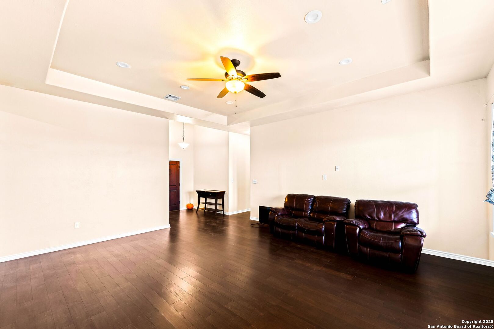 2211 Geneva Street Castroville, TX 78009 - Photo 7 of 41 a living room with furniture and wooden floor