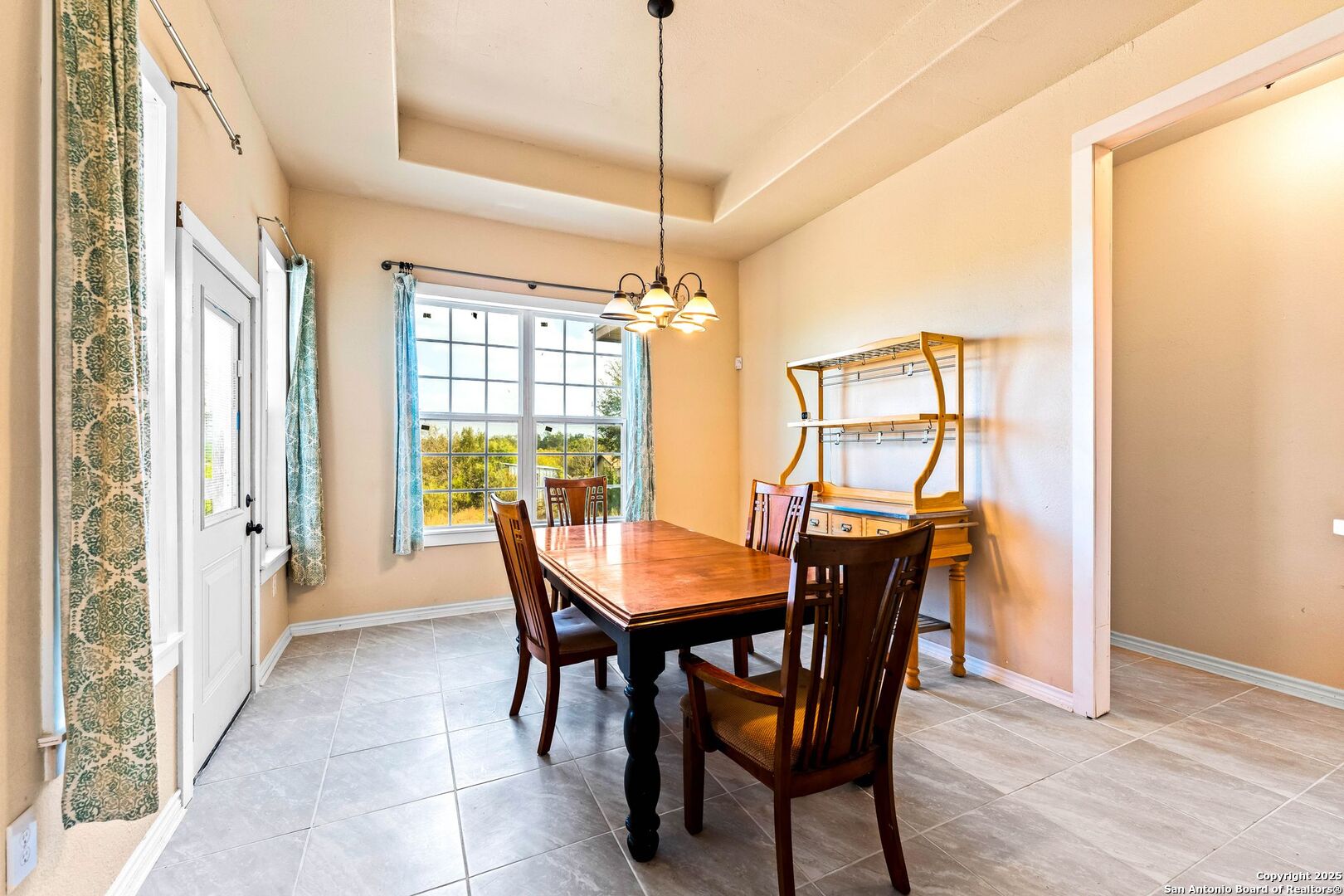 2211 Geneva Street Castroville, TX 78009 - Photo 9 of 41 a view of a dining room with furniture window and outside view
