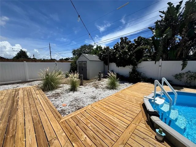 a view of a backyard and chairs