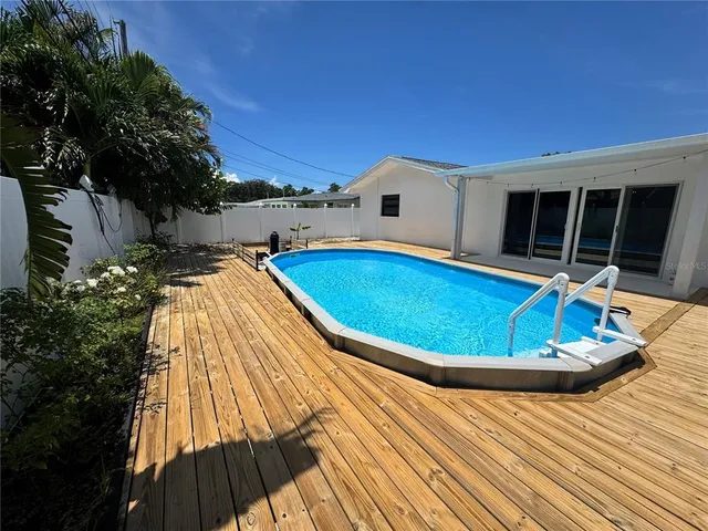 a view of swimming pool with seating space