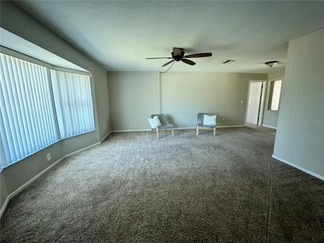 a view of a room with lots of trees in it