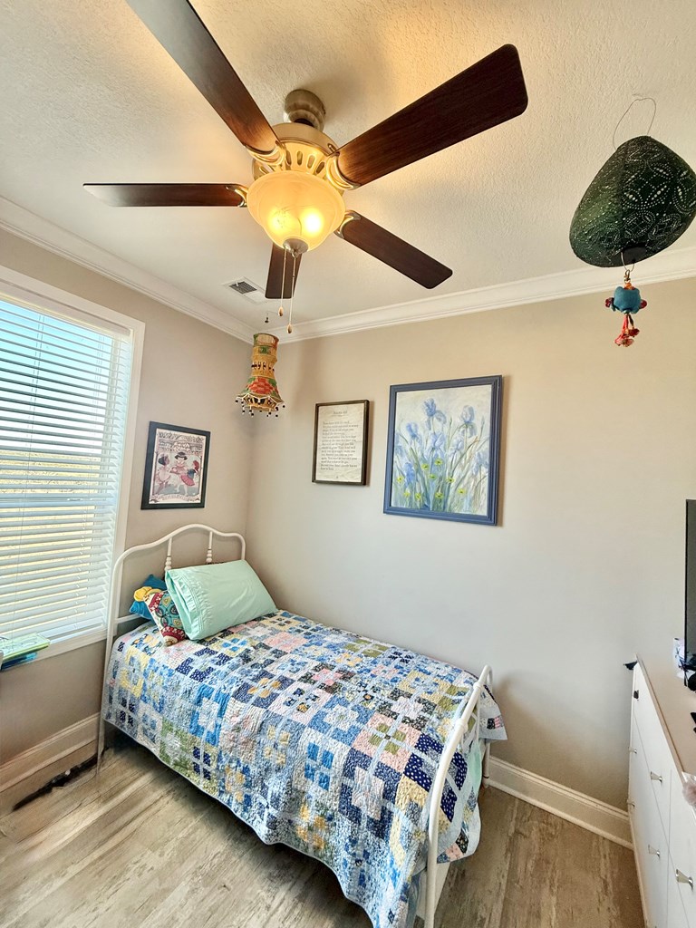 589 Scott Branch Road Harper, TX 78631 - Photo 13 of 21 a bedroom with a bed and a painting on the wall