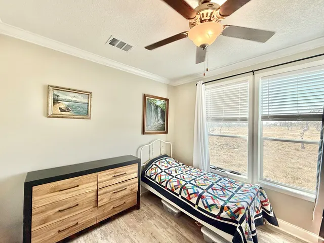 a bed room with a bed and a window