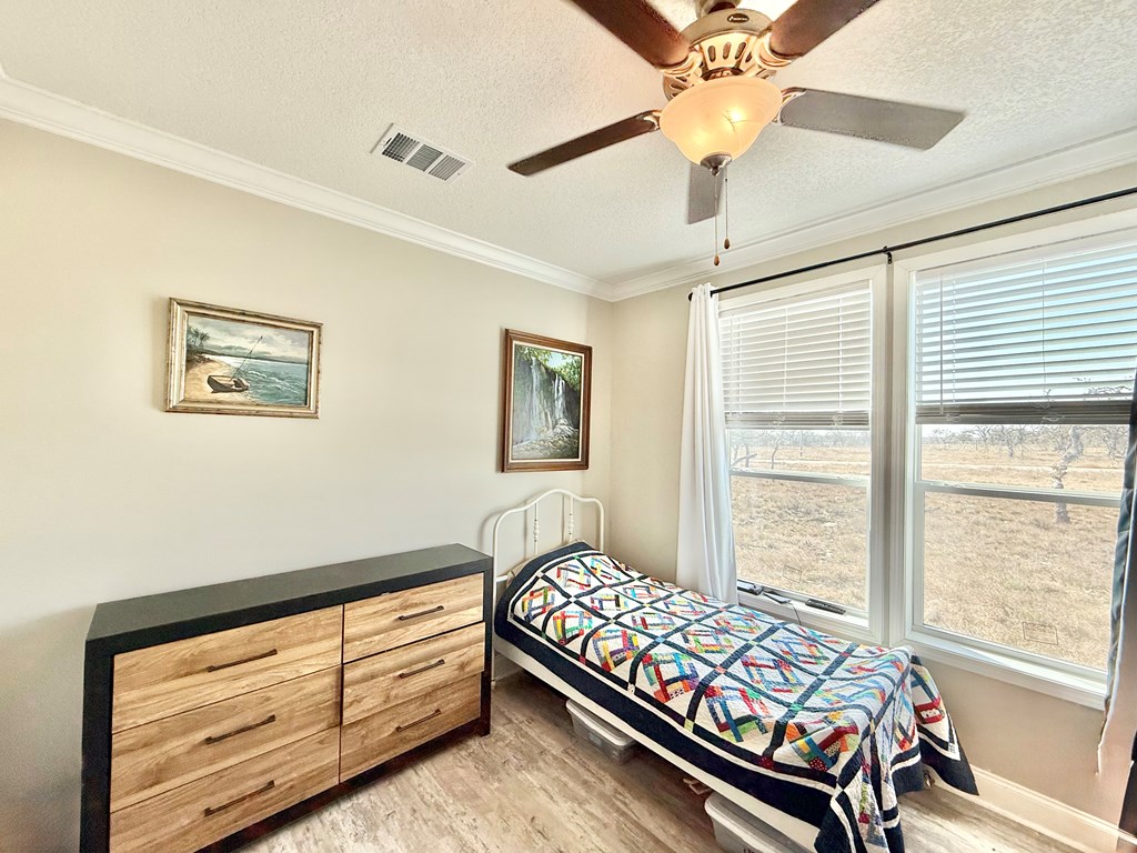 589 Scott Branch Road Harper, TX 78631 - Photo 15 of 21 a bed room with a bed and a window