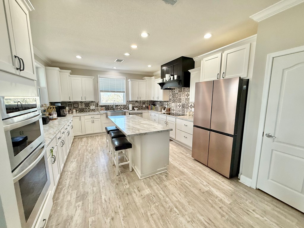 589 Scott Branch Road Harper, TX 78631 - Photo 5 of 21 a kitchen with a refrigerator a sink and dishwasher