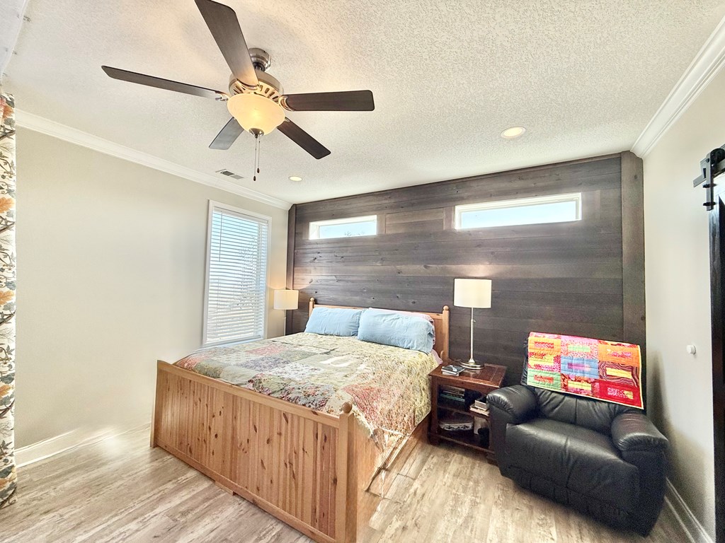 589 Scott Branch Road Harper, TX 78631 - Photo 10 of 21 a bedroom with a bed couch and window