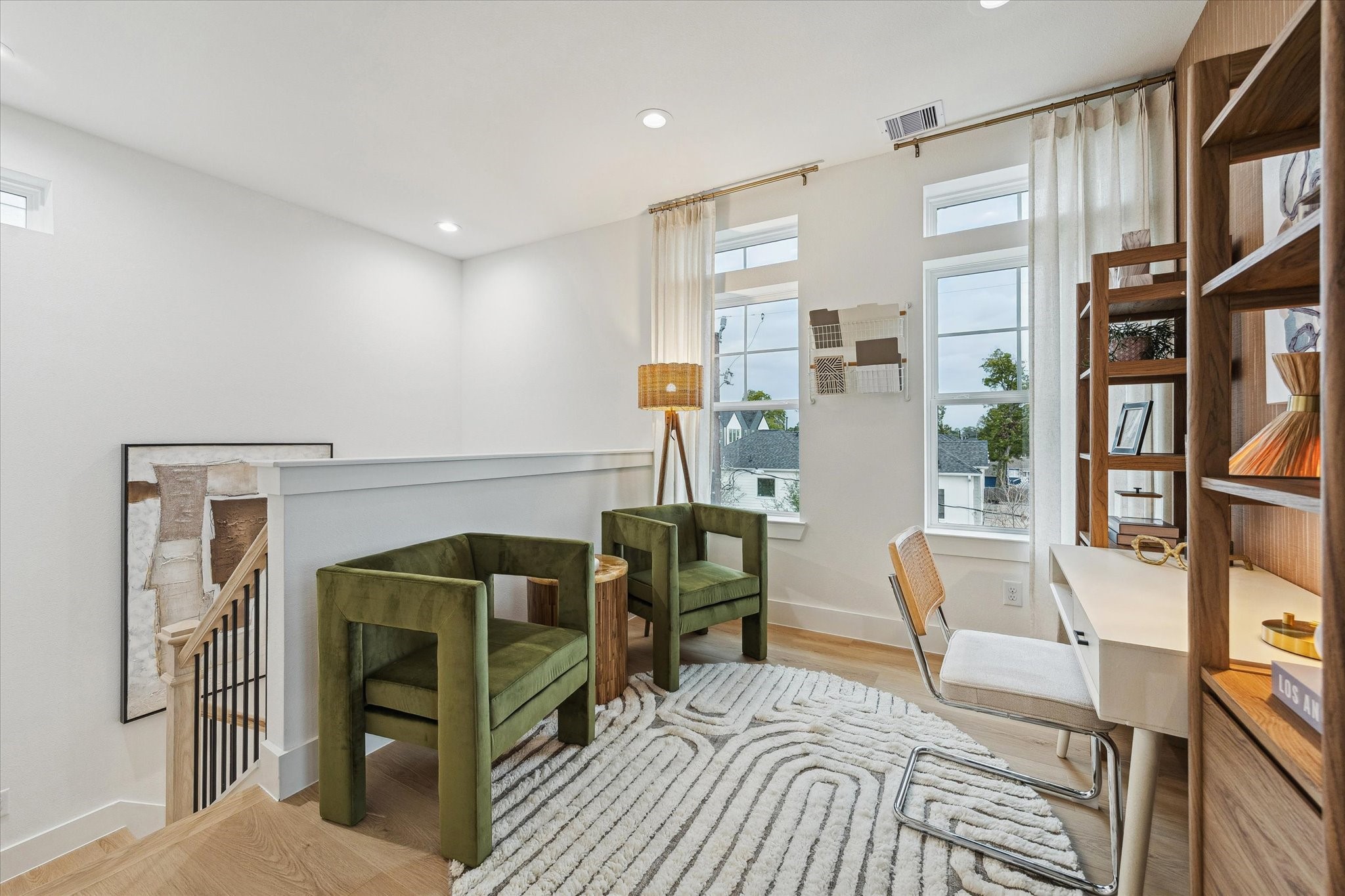 752 Curtin Street Houston, TX 77018 - Photo 28 of 37 Bright and inviting loft space featuring modern decor, large windows for natural light, and a cozy seating area ideal for relaxation or work.