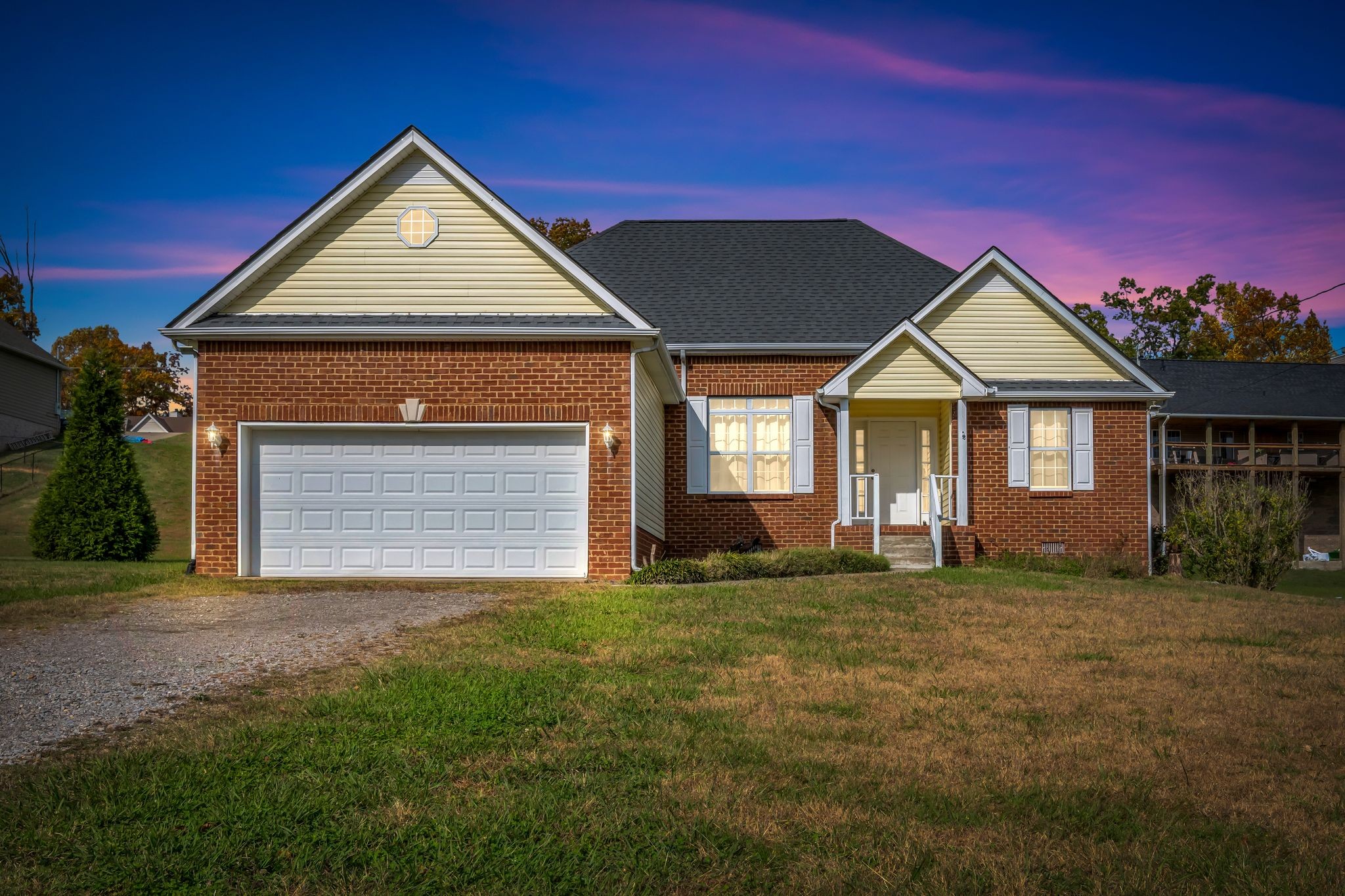 a front view of a house with a yard
