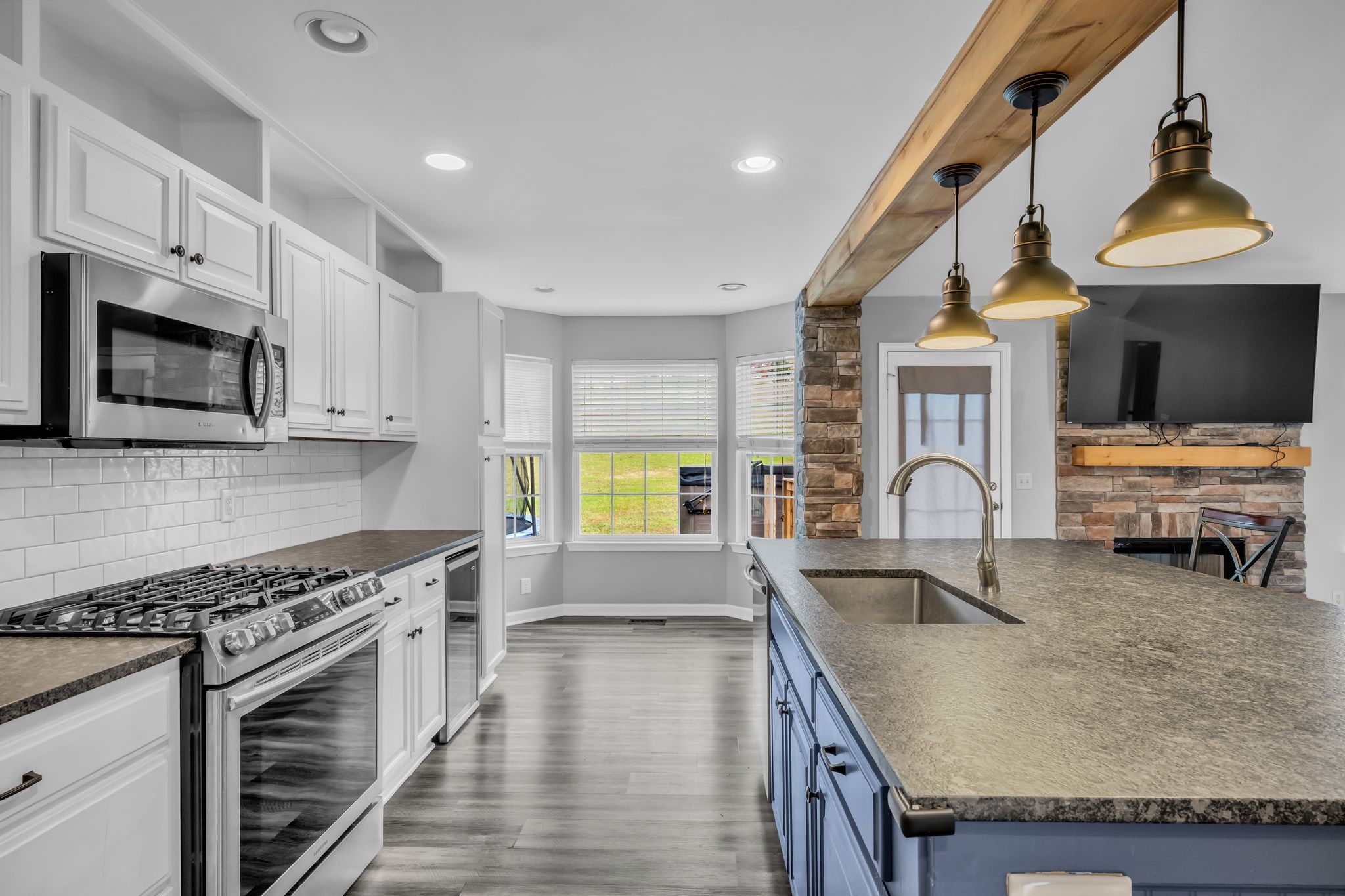 1345 Nails Creek Road Dickson, TN 37055 - Photo 11 of 27 a kitchen with stainless steel appliances granite countertop a stove and a sink