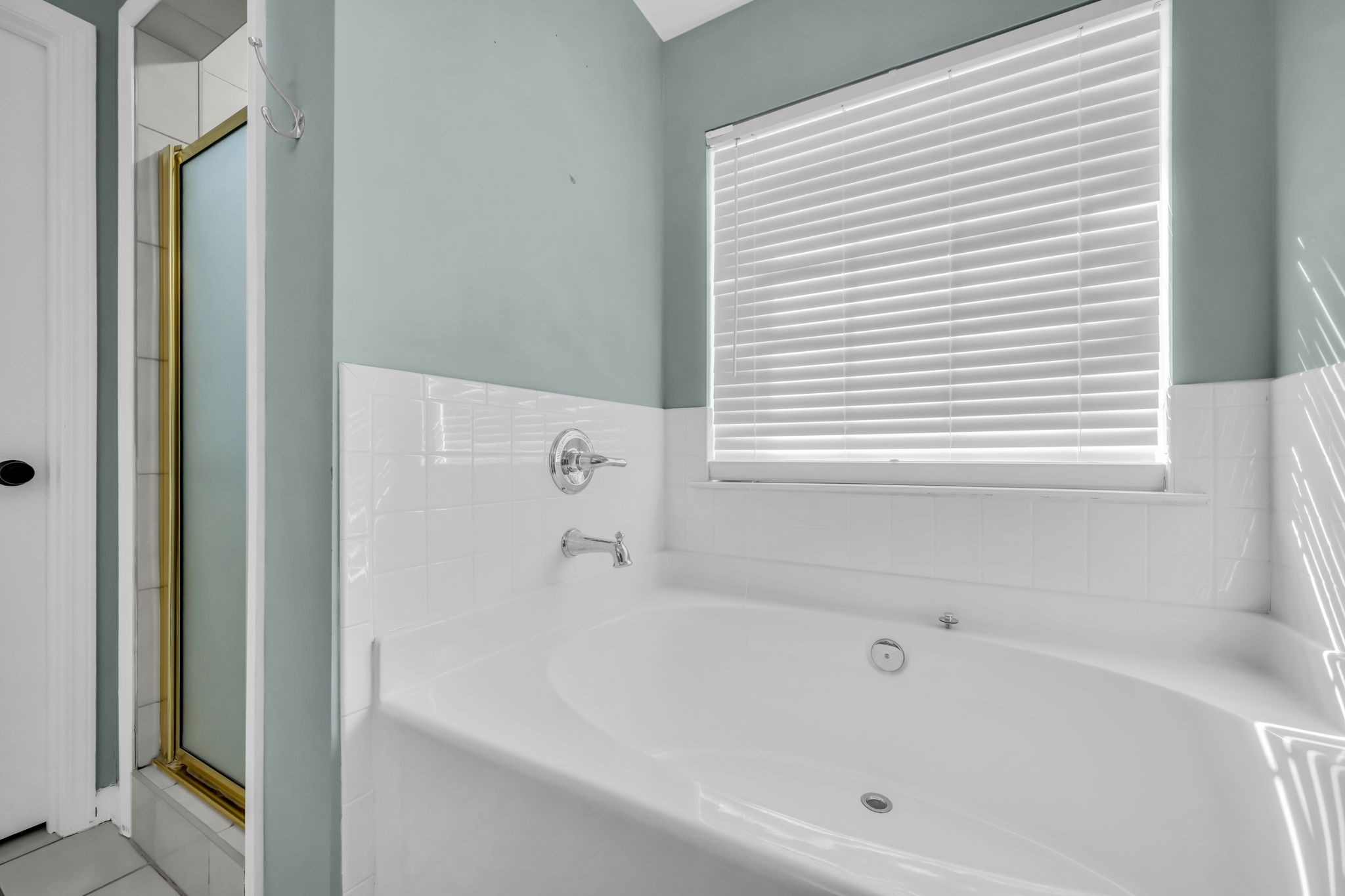 1345 Nails Creek Road Dickson, TN 37055 - Photo 19 of 27 a white bath tub sitting next to a white sink