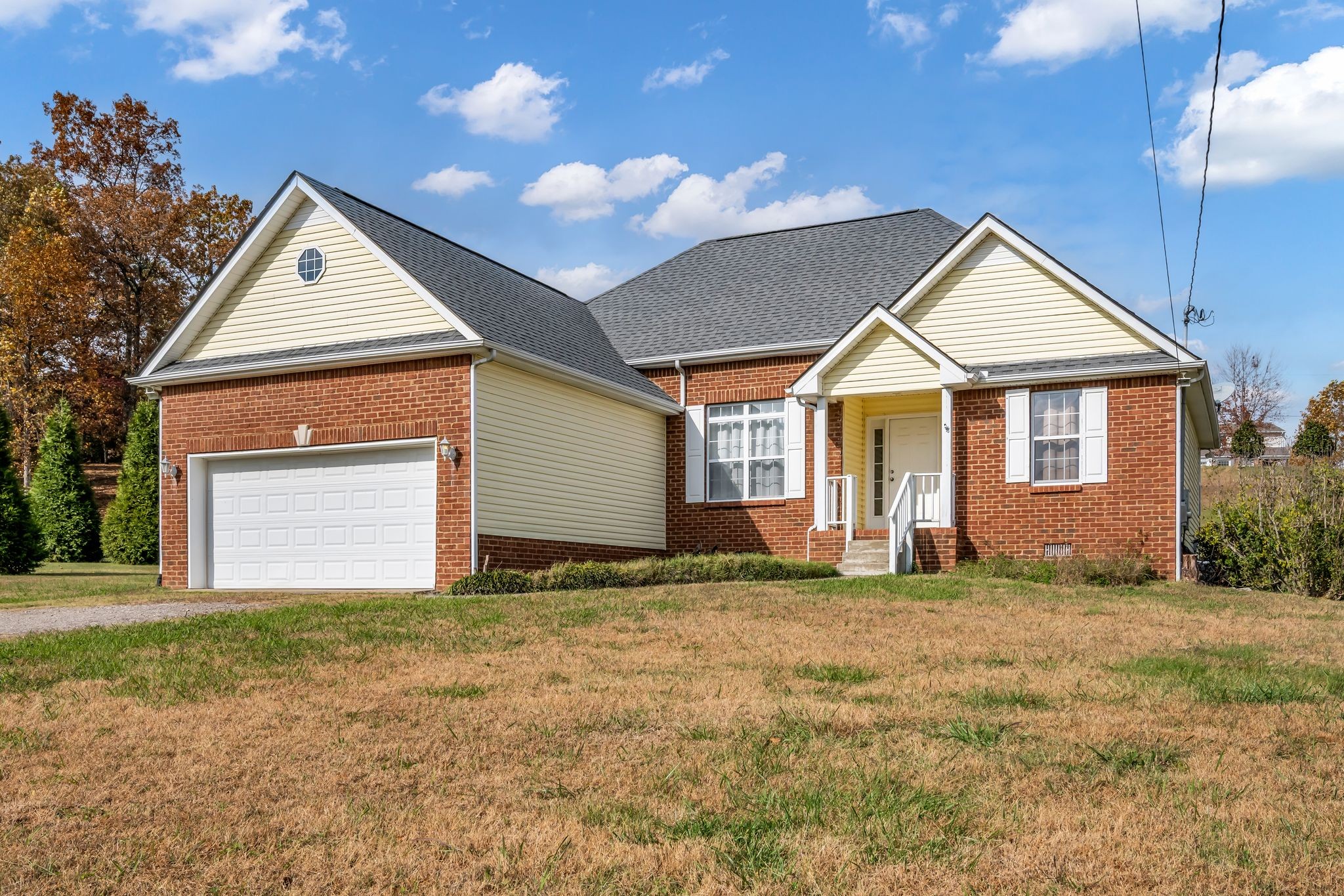 1345 Nails Creek Road Dickson, TN 37055 - Photo 2 of 27 a view of a house with a yard and garage