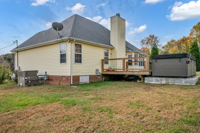 a view of a house with a backyard