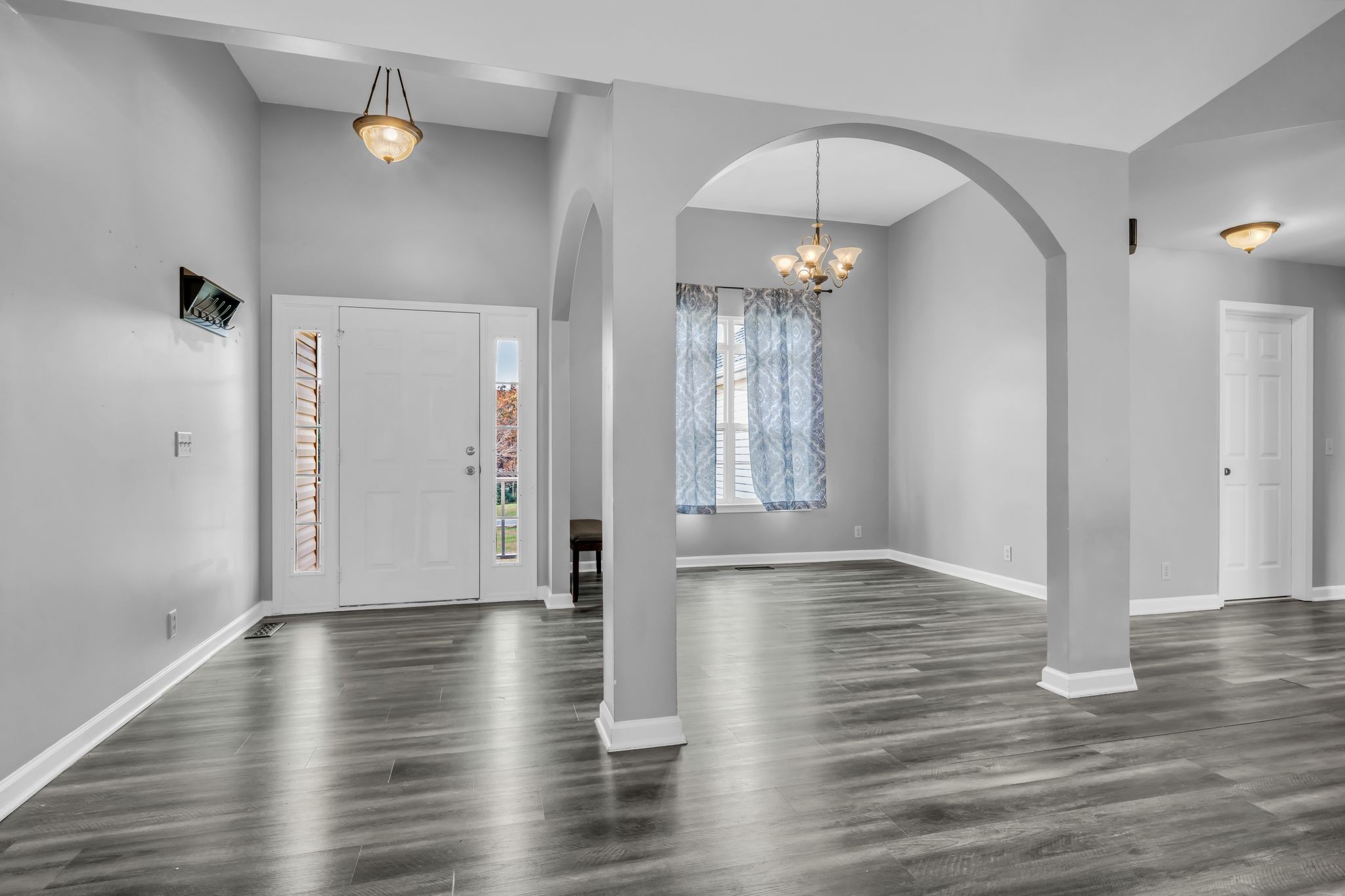 1345 Nails Creek Road Dickson, TN 37055 - Photo 8 of 27 a view of an empty room with wooden floor and a window