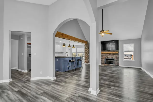 a view of kitchen with furniture and wooden floor