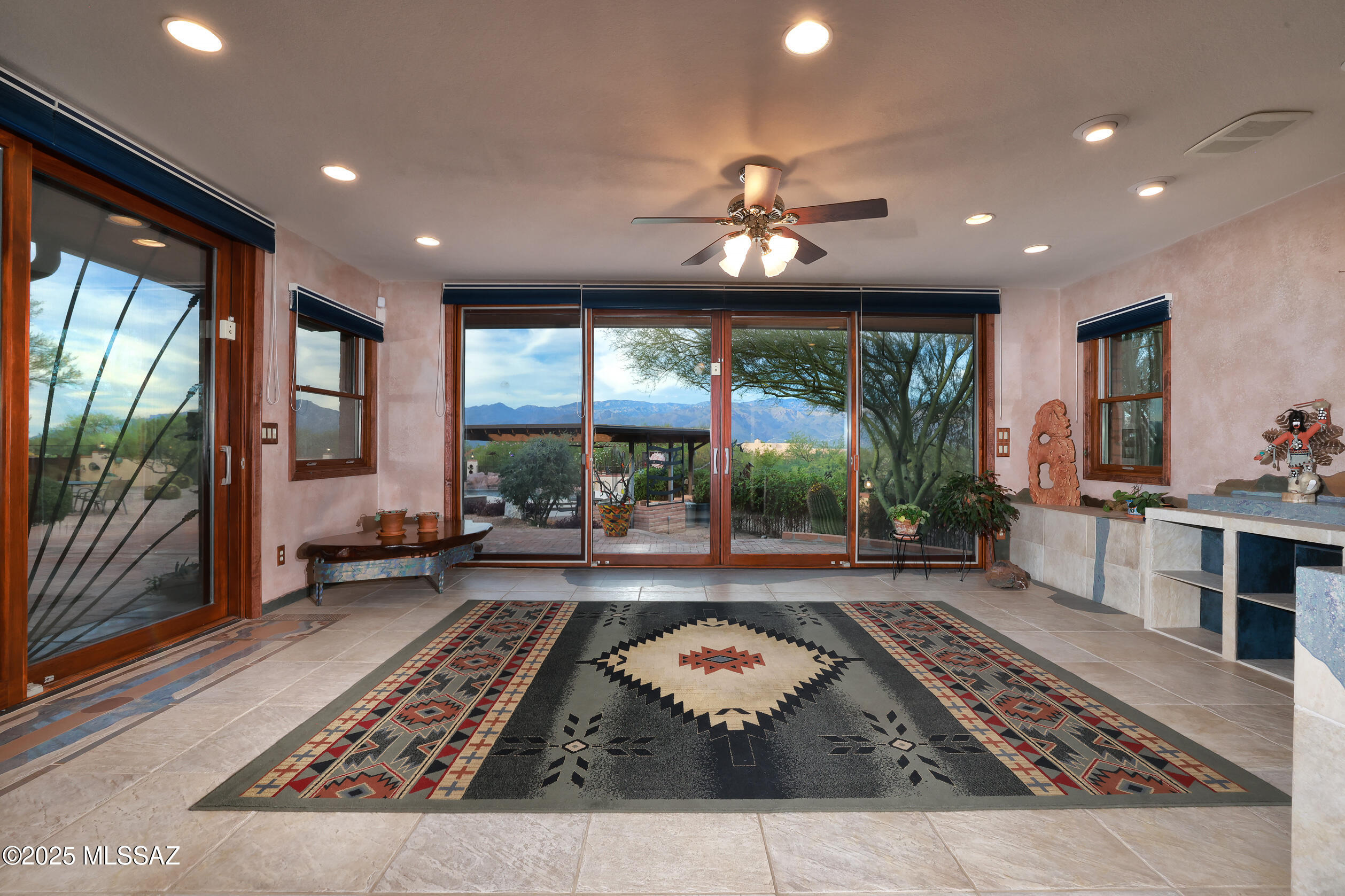 925 North Rancho Del Jefe Loop Tucson, AZ 85748 - Photo 6 of 52 a living room with furniture and a floor to ceiling window