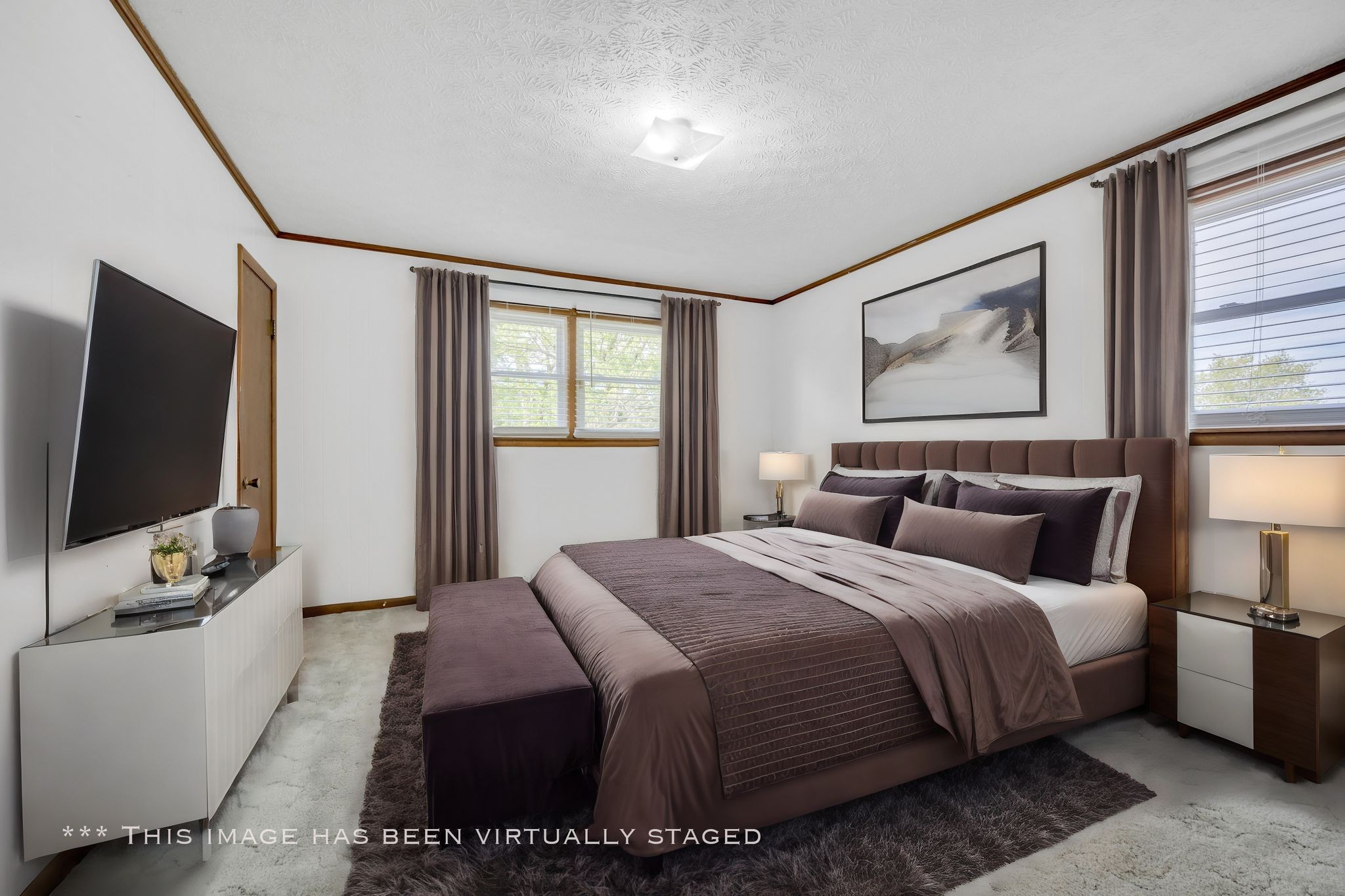 1300 2 Mile Road Burns, TN 37029 - Photo 21 of 38 a bedroom with a bed and a flat screen tv