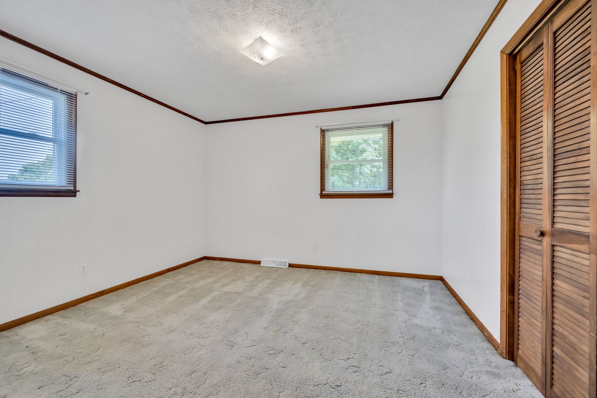 1300 2 Mile Road Burns, TN 37029 - Photo 25 of 38 an empty room with windows