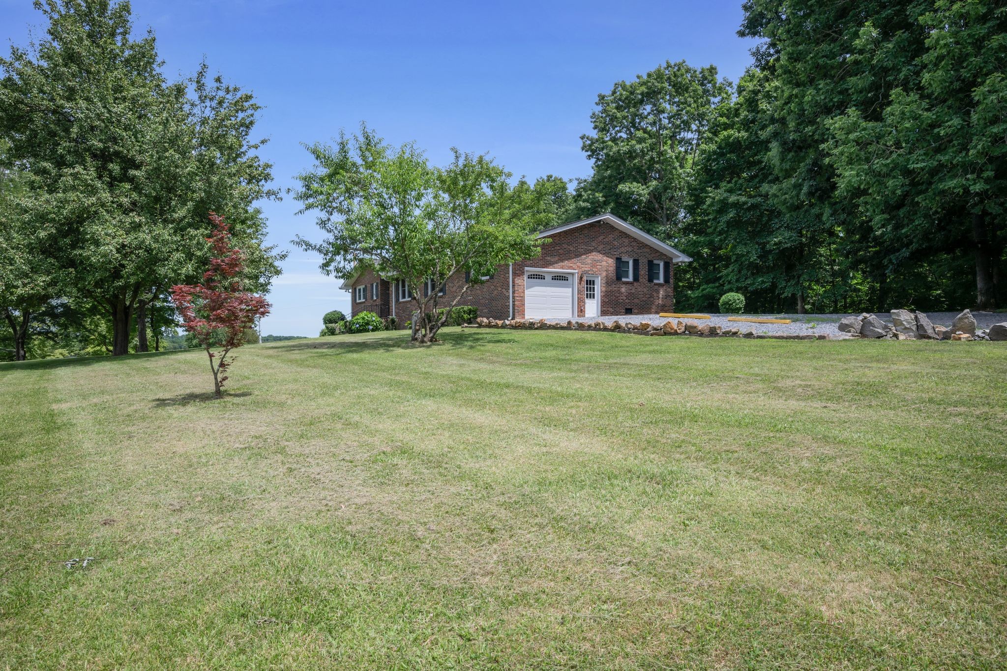 1300 2 Mile Road Burns, TN 37029 - Photo 5 of 38 a view of a house with a yard