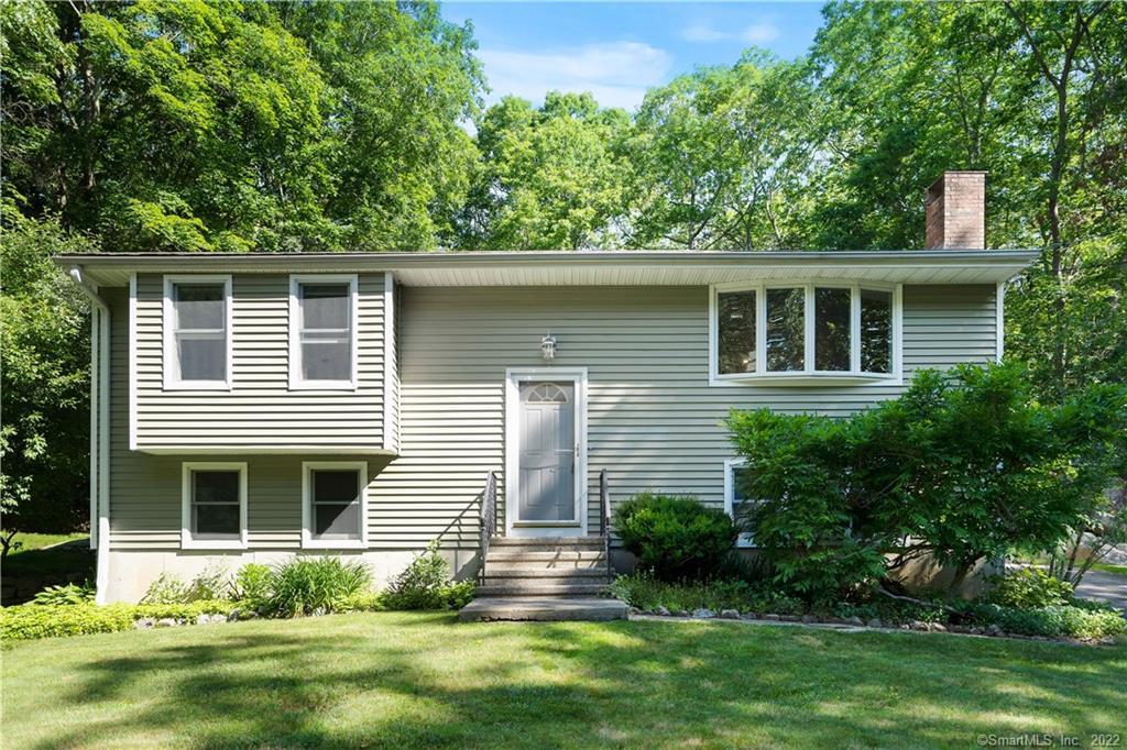 742 North Madison Road Guilford, CT 06437 - Photo 1 of 1 a front view of a house with a yard