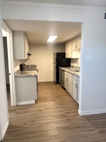 a large kitchen with a stove top oven