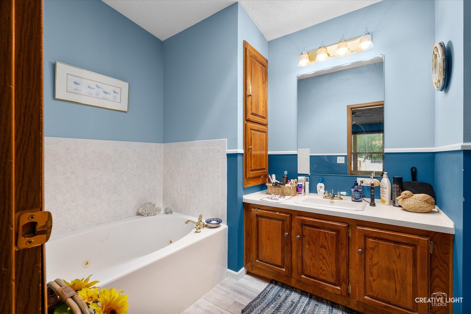 132 Cardinal Lane Sandwich, IL 60548 - Photo 13 of 17 a bathroom with a tub sink and a window