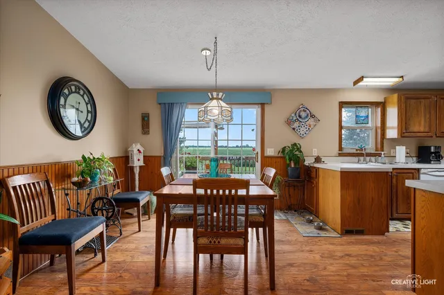 a view of a dining room with furniture window and outside view