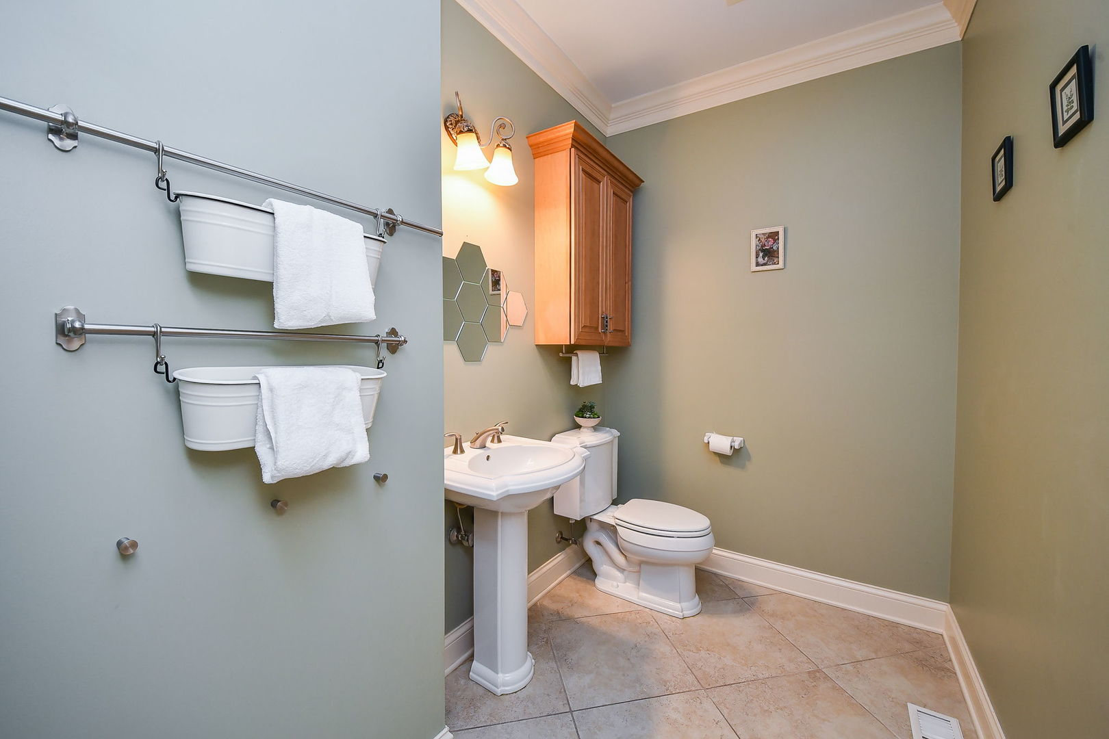 1811 Rizzi Lane, Unit 1811 Bartlett, IL 60103 - Photo 11 of 29 a bathroom with a toilet sink and mirror