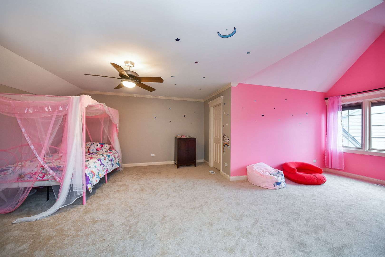 1811 Rizzi Lane, Unit 1811 Bartlett, IL 60103 - Photo 17 of 29 a bedroom with furniture and a chandelier