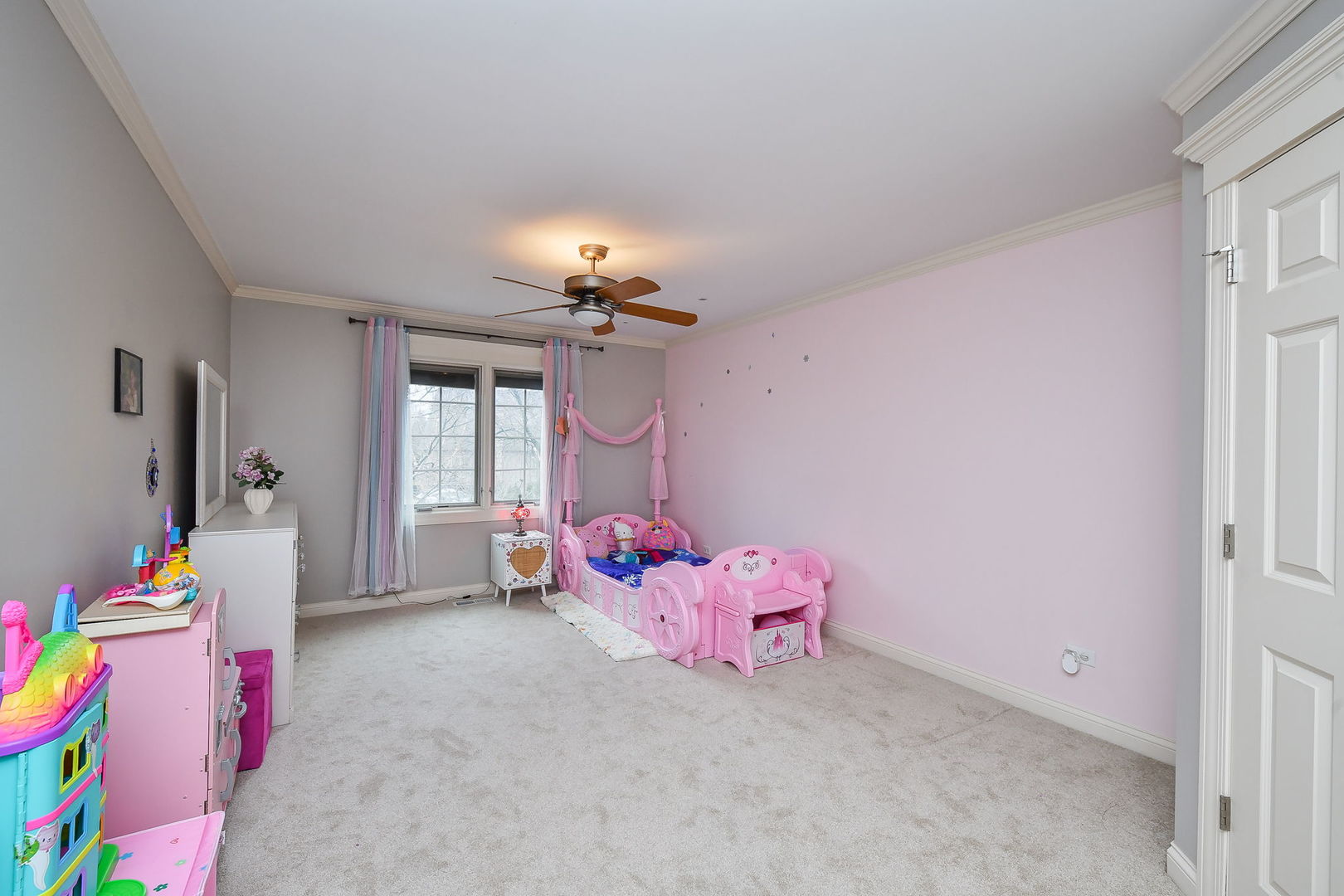 1811 Rizzi Lane, Unit 1811 Bartlett, IL 60103 - Photo 18 of 29 a bedroom with furniture and chandelier