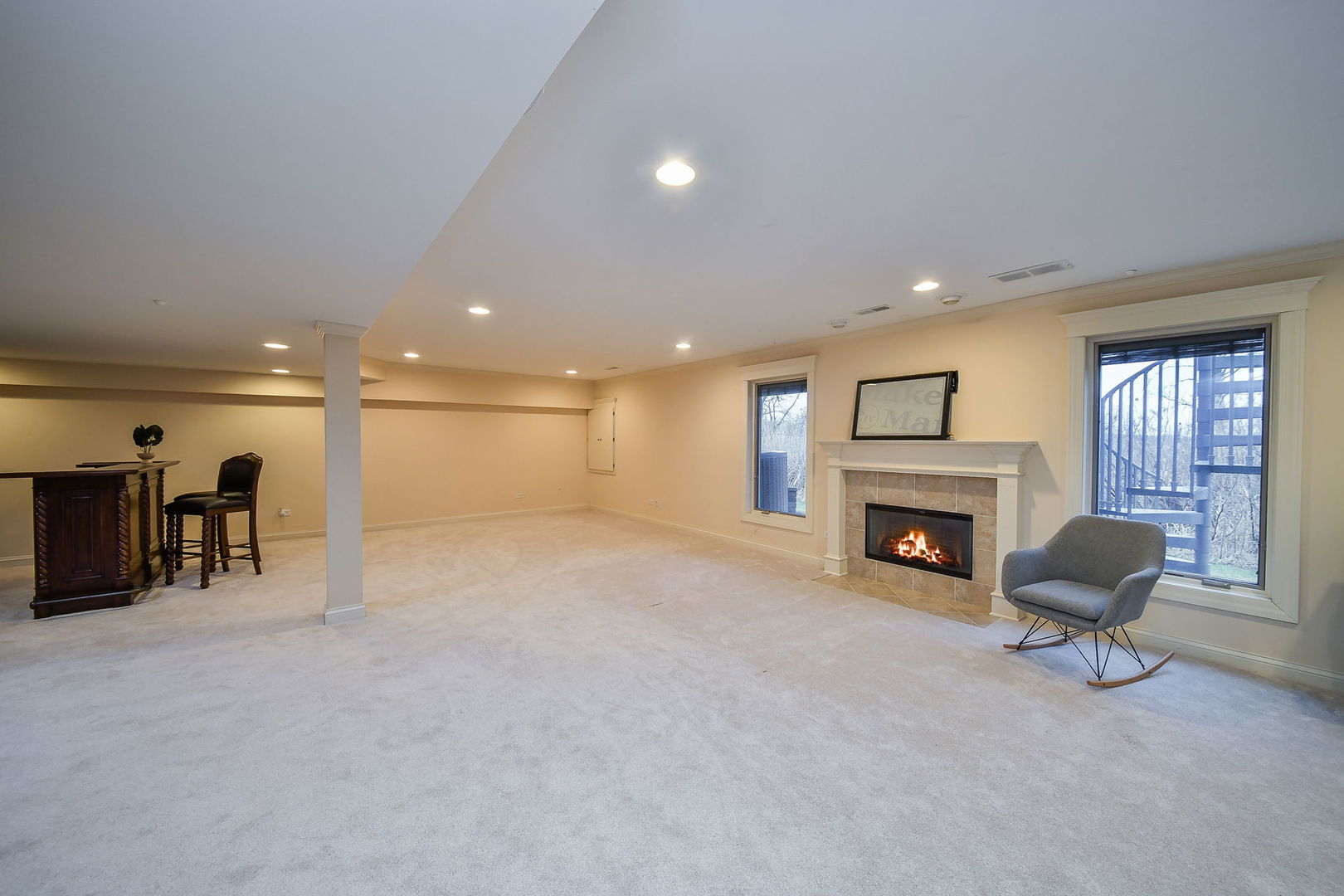 1811 Rizzi Lane, Unit 1811 Bartlett, IL 60103 - Photo 21 of 29 a view of an empty room with a fireplace