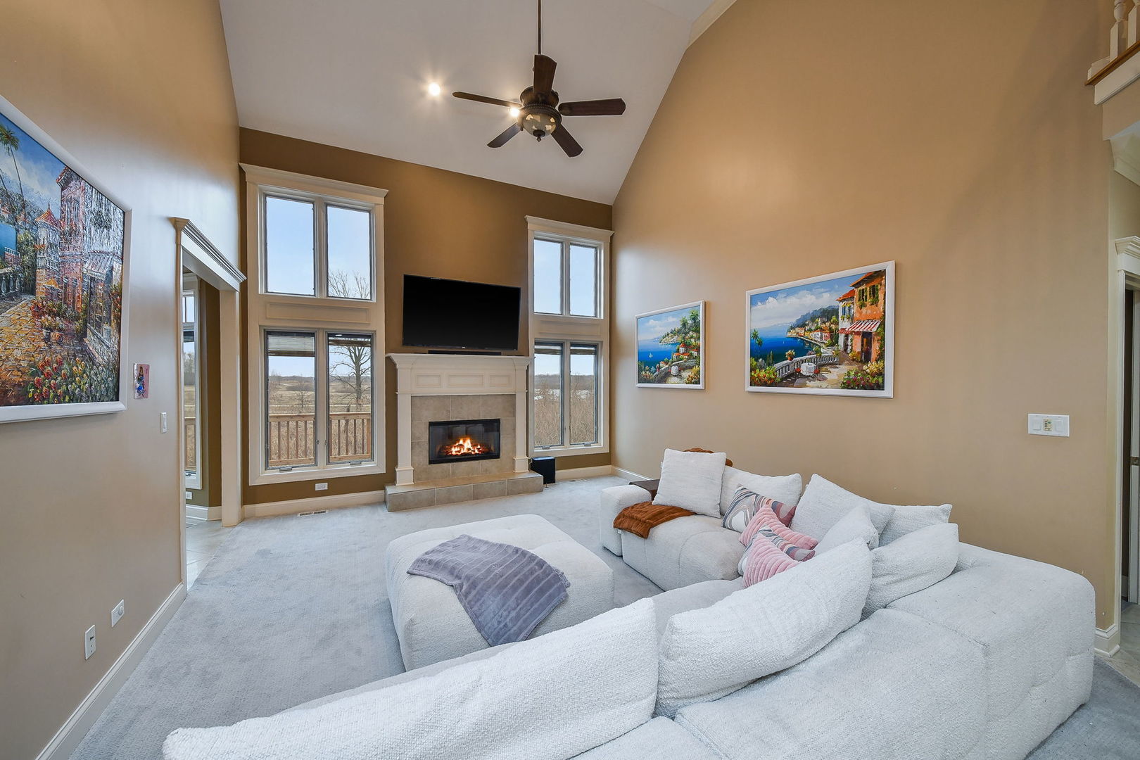 1811 Rizzi Lane, Unit 1811 Bartlett, IL 60103 - Photo 5 of 29 a living room with furniture a fireplace and a flat screen tv