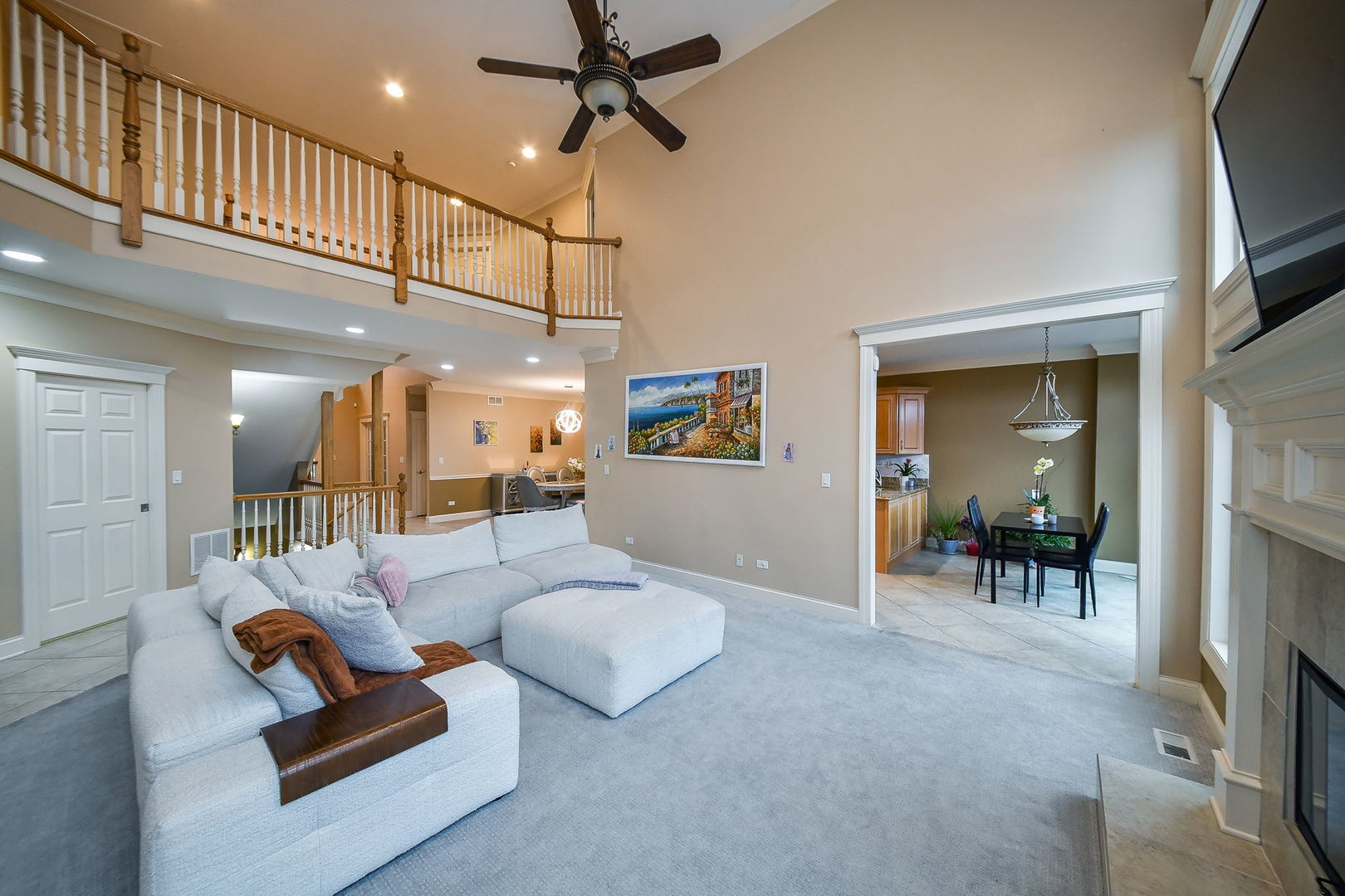1811 Rizzi Lane, Unit 1811 Bartlett, IL 60103 - Photo 6 of 29 a living room with furniture and a flat screen tv